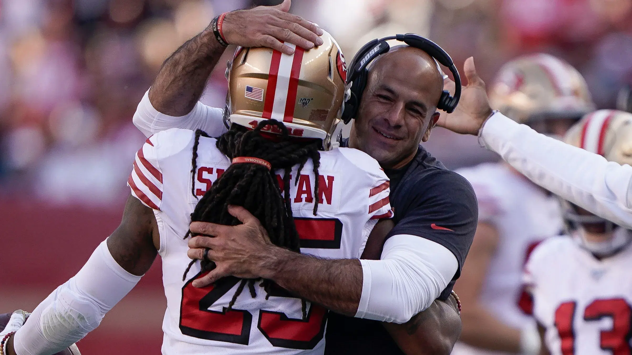 Richard Sherman hugs Robert Saleh / Stan Szeto/USA TODAY