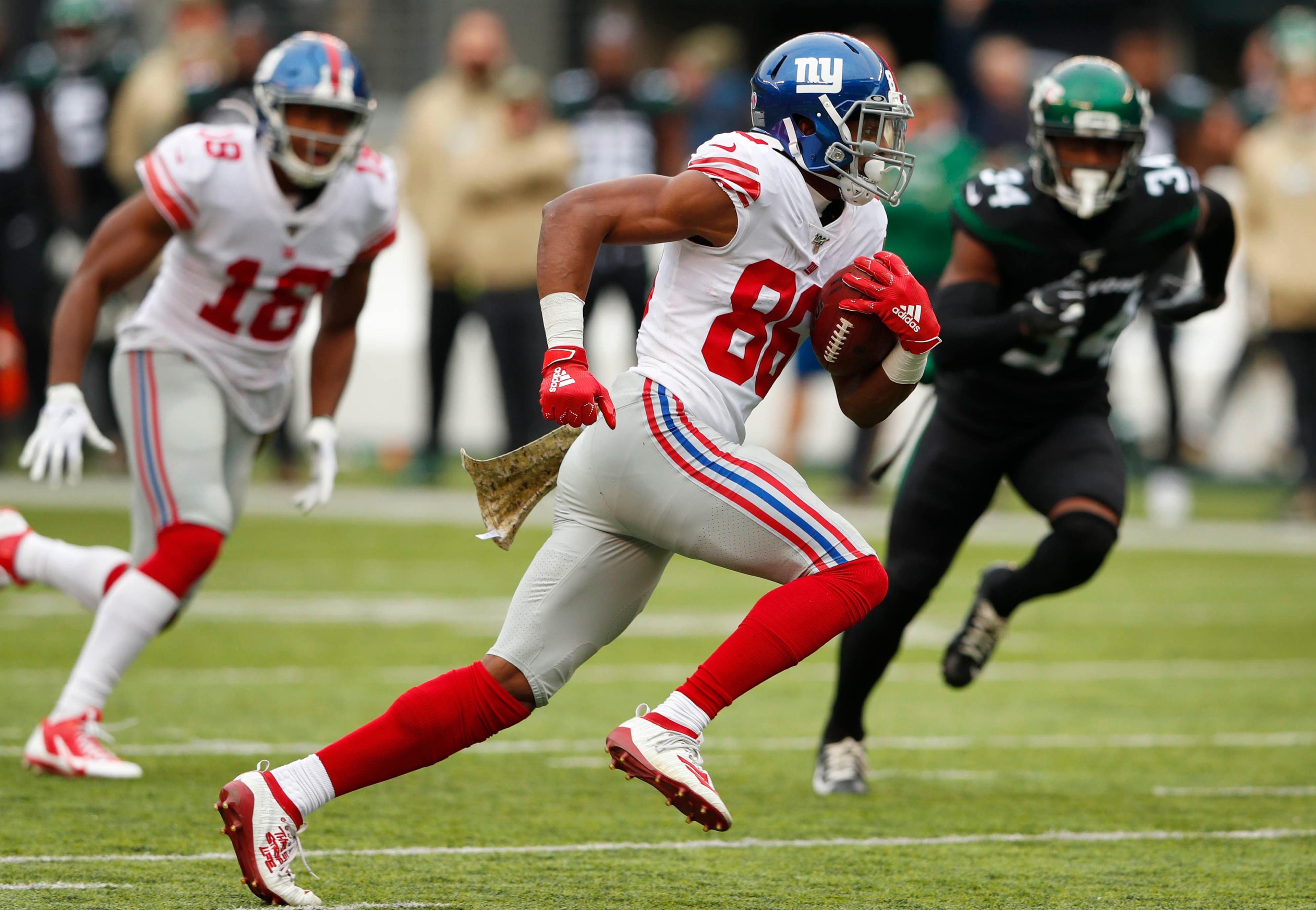 Nov 10, 2019; East Rutherford, NJ, USA; New York Giants wide receiver Darius Slayton (86) scores a touchdown against the New York Jets during the second quarter at MetLife Stadium. Mandatory Credit: Noah K. Murray-USA TODAY Sports / Noah K. Murray