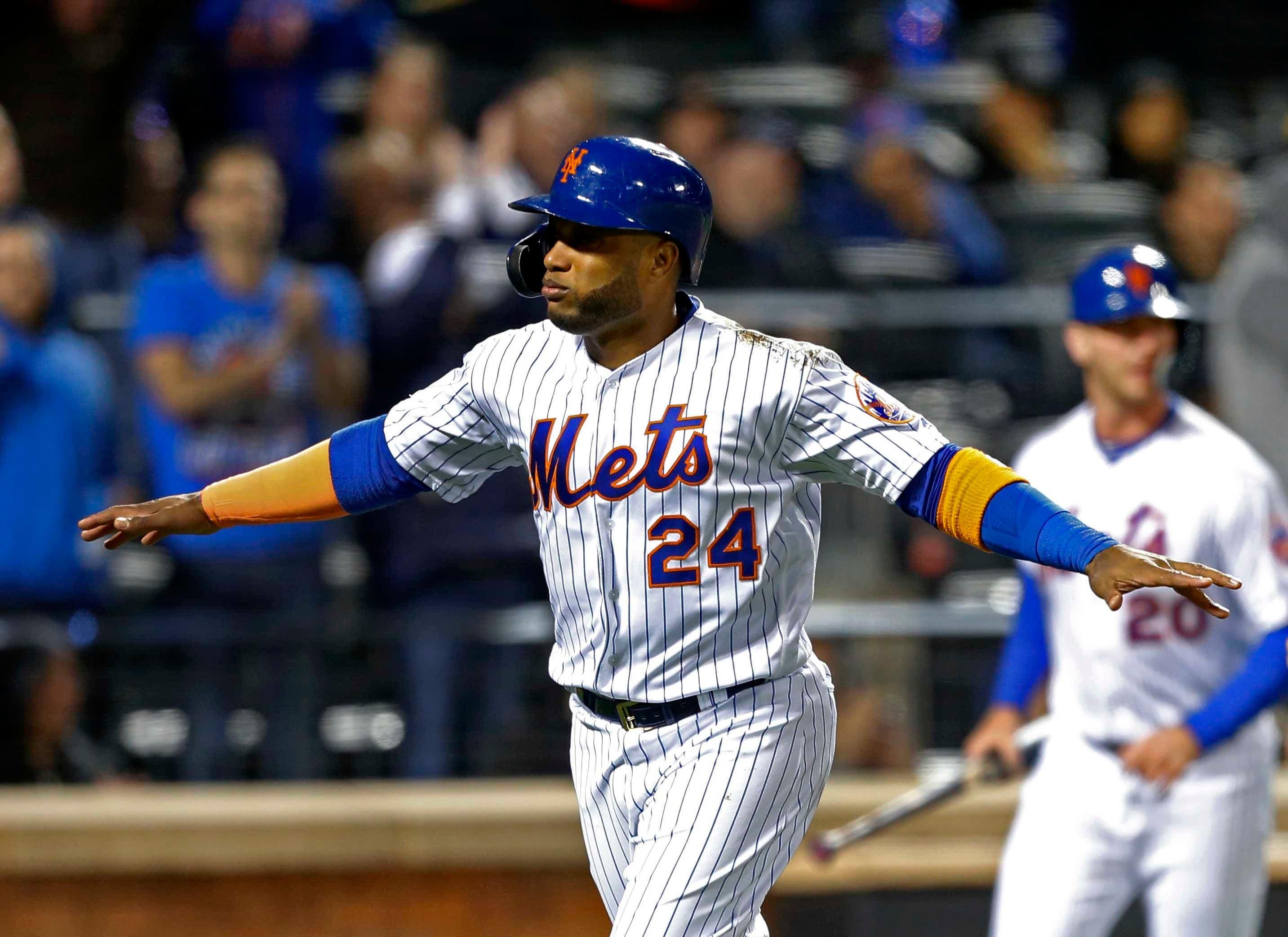 Apr 10, 2019; New York City, NY, USA; New York Mets second baseman Robinson Cano (24) reacts after scoring in the fifth inning against the Minnesota Twins at Citi Field. Mandatory Credit: Noah K. Murray-USA TODAY Sports / Noah K. Murray