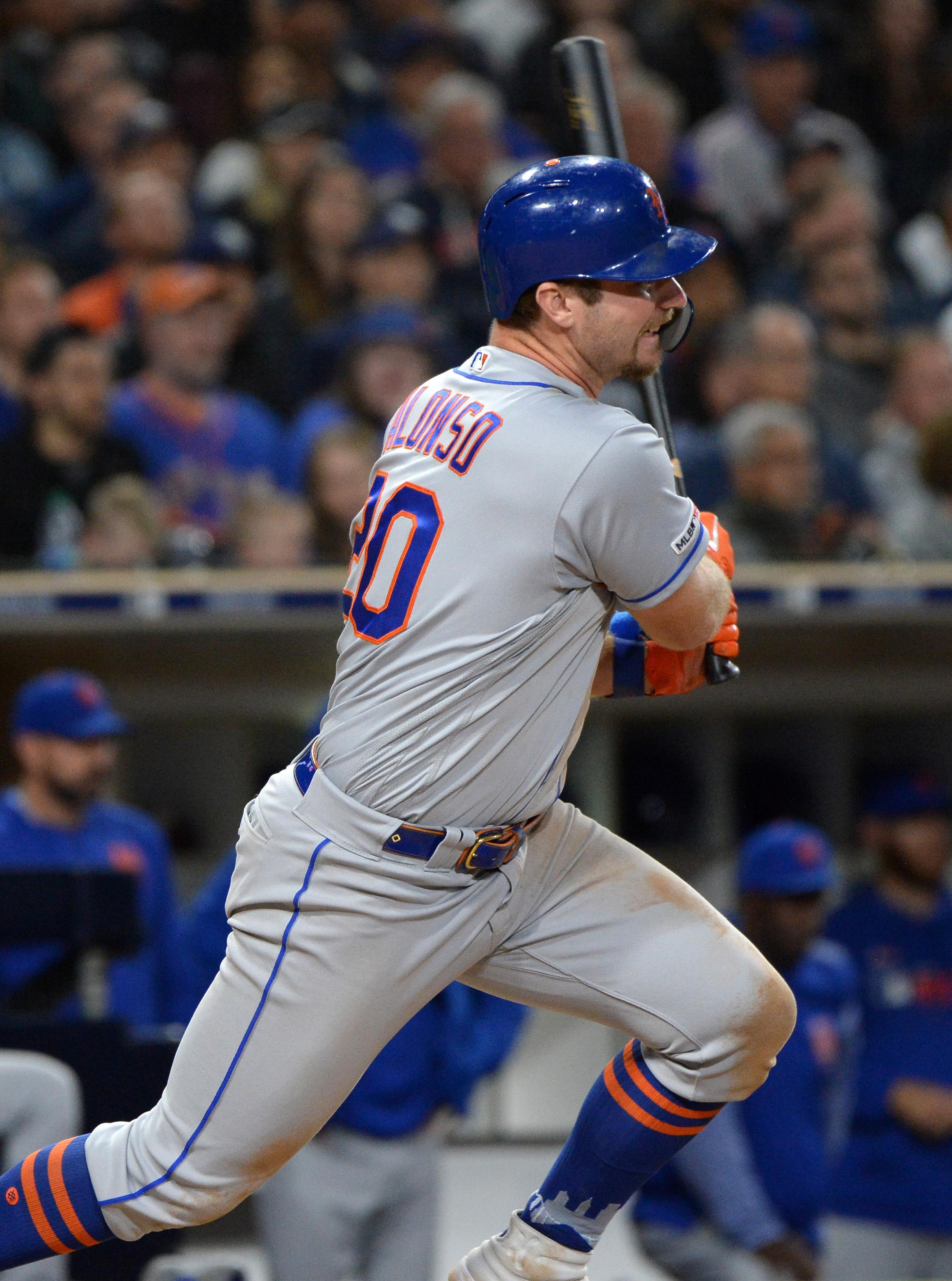 May 7, 2019; San Diego, CA, USA; New York Mets first baseman Pete Alonso (20) hits an RBI single in the seventh inning against the San Diego Padres at Petco Park. Mandatory Credit: Jake Roth-USA TODAY Sports