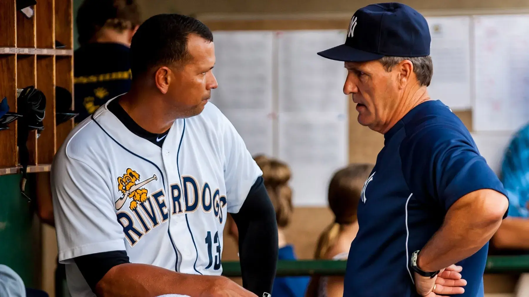 Jul 3, 2013; Charleston, SC, USA; New York Yankees third baseman Alex Rodriguez, as part of the Charleston RiverDogs, speaks with Yankees Director of Player development Pat Roessler after leaving the game following the third inning of a rehab game against the Rome Braves at Joseph P. Riley, Jr. Park. / Jeff Blake-USA TODAY Sports