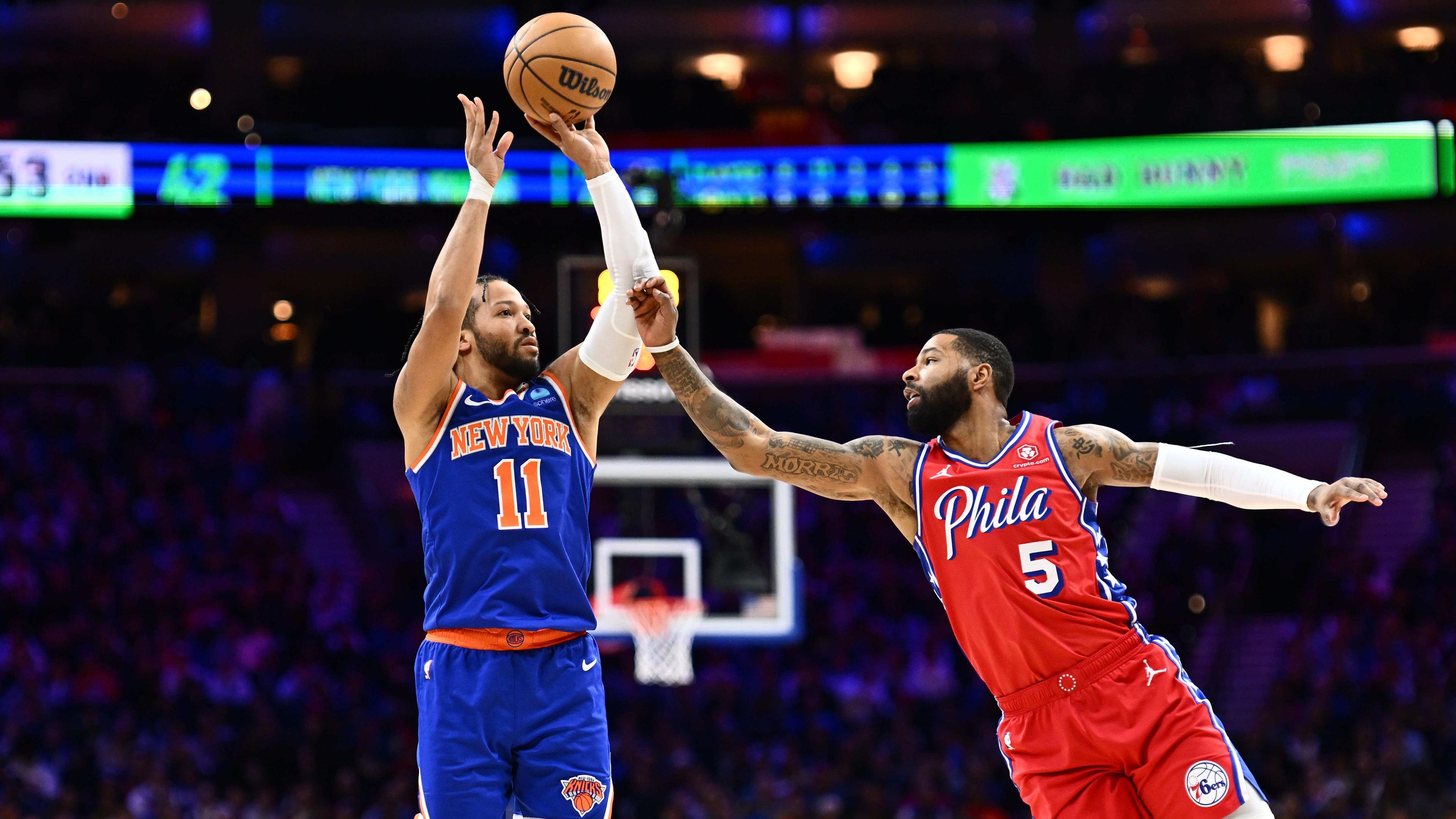 Jan 5, 2024; Philadelphia, Pennsylvania, USA; New York Knicks guard Jalen Brunson (11) shoots against Philadelphia 76ers forward Marcus Morris Sr (5) in the second quarter at Wells Fargo Center. Mandatory Credit: Kyle Ross-Imagn Images