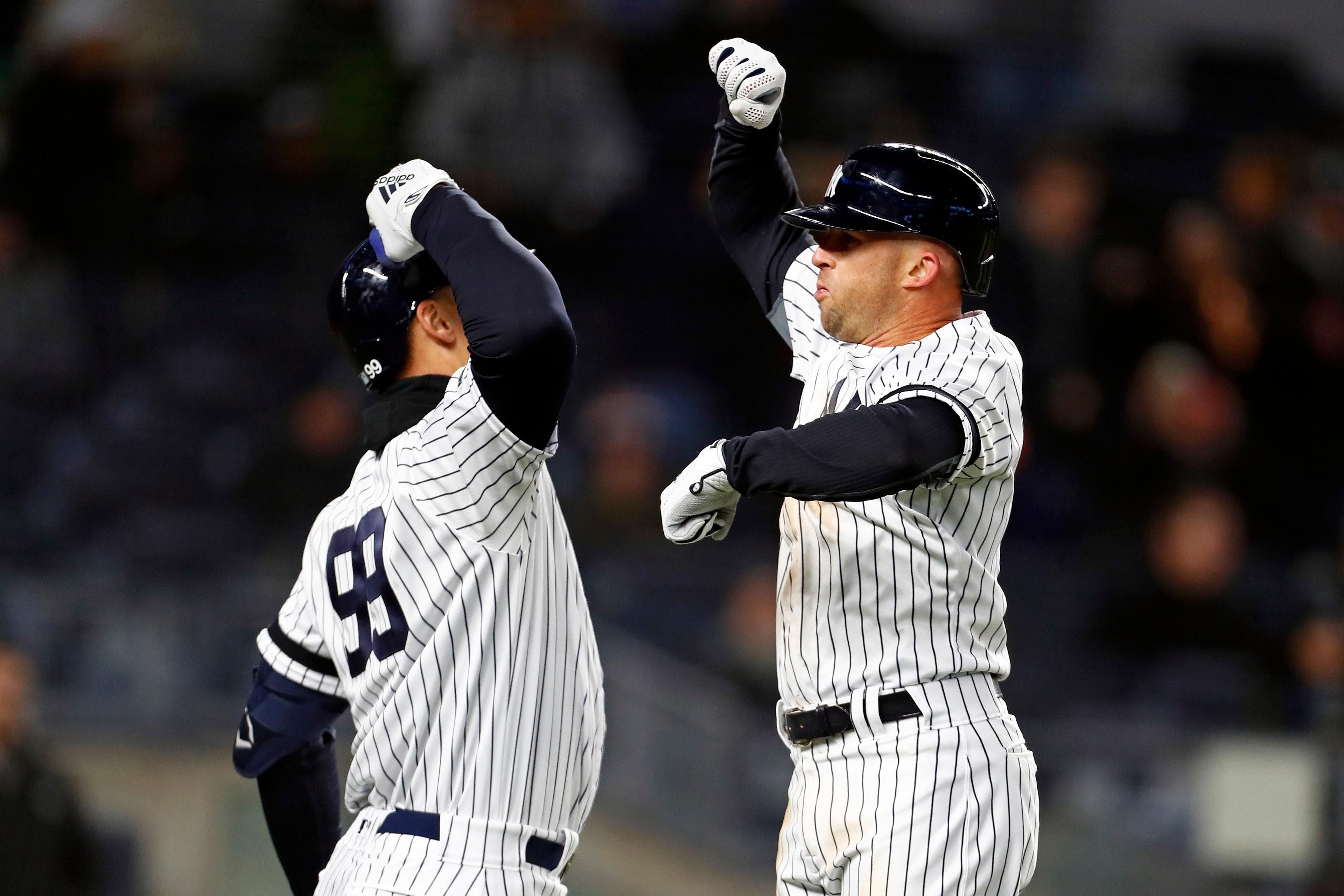 New York Yankees left fielder Brett Gardner celebrates hitting a solo home run with Yankees right fielder Aaron Judge during the fifth inning against the Detroit Tigers at Yankee Stadium. / Adam Hunger/USA TODAY Sports