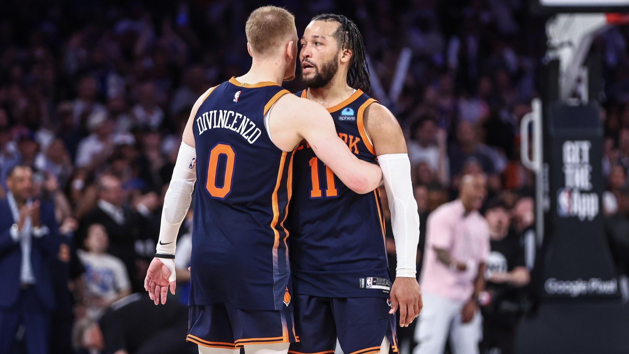 May 8, 2024; New York, New York, USA; New York Knicks guards Donte DiVincenzo (0) and Jalen Brunson (11) embrace after defeating the Indiana Pacers 130-121 in game two of the second round for the 2024 NBA playoffs at Madison Square Garden. / Wendell Cruz-USA TODAY Sports