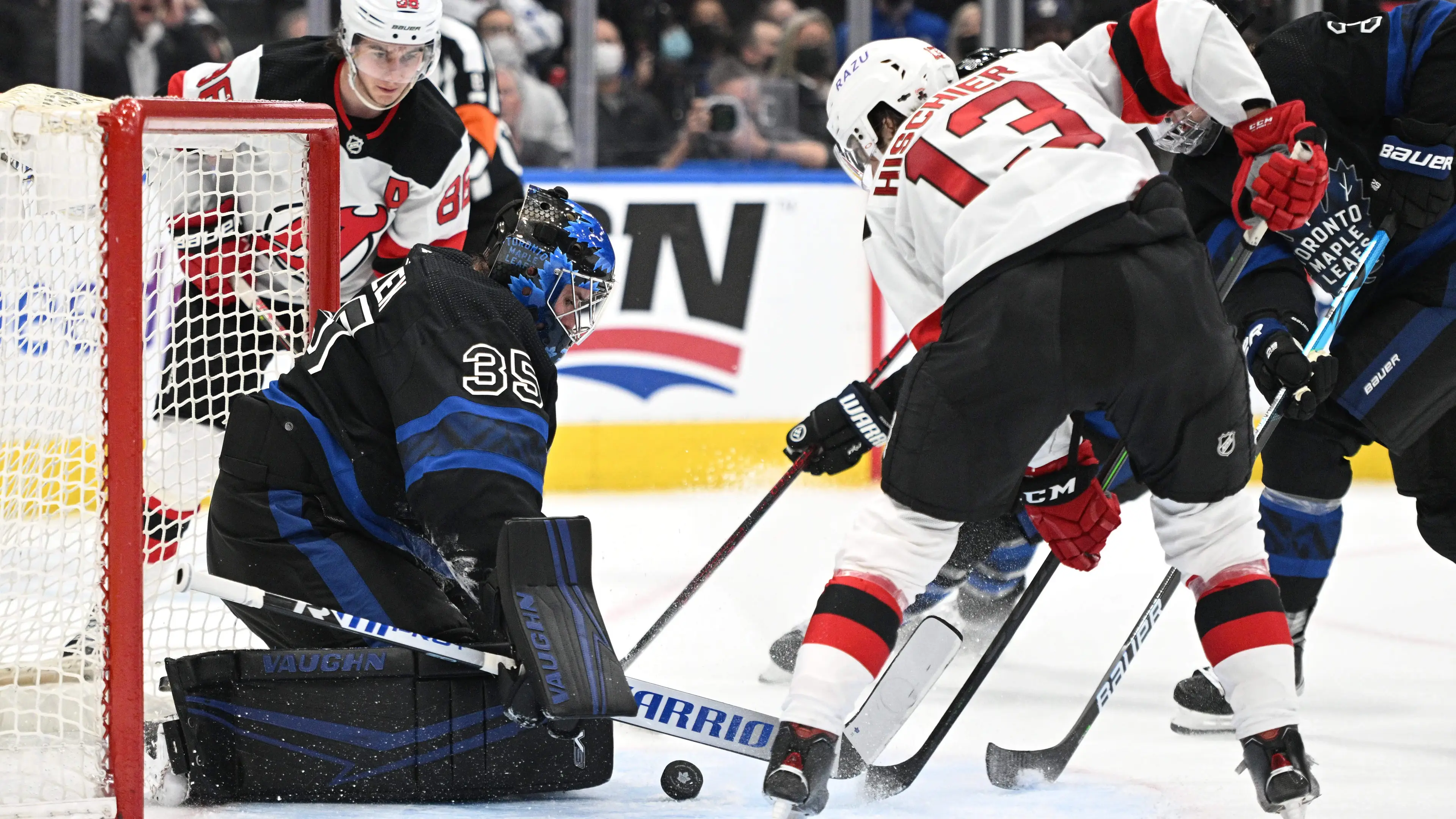 Mar 23, 2022; Toronto, Ontario, CAN; New Jersey Devils forward Nico Hischier (13) scores against Toronto Maple Leafs goalie Petr Mrazek (35) in the second period at Scotiabank Arena. / Dan Hamilton-USA TODAY Sports