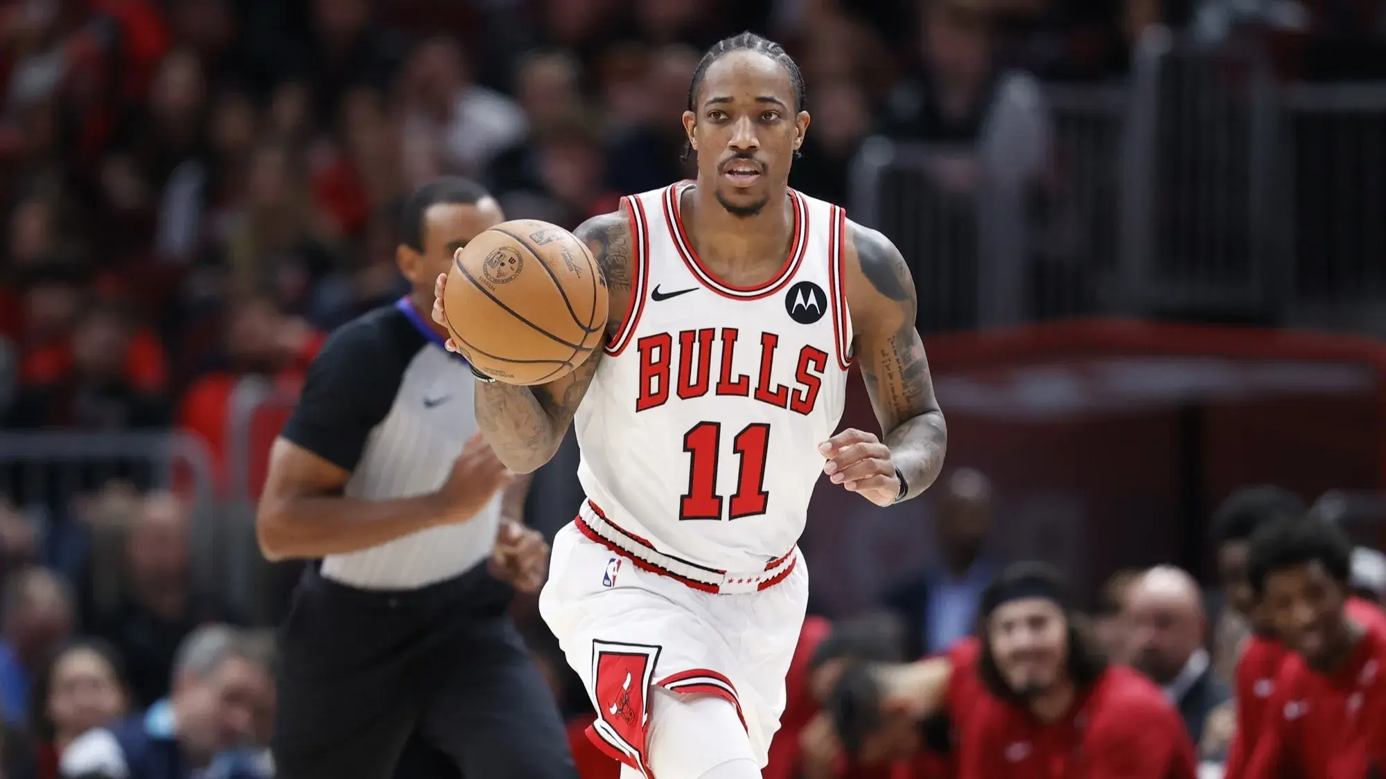 Nov 20, 2023; Chicago, Illinois, USA; Chicago Bulls forward DeMar DeRozan (11) brings the ball up court against the Miami Heat during the first half at United Center. / Kamil Krzaczynski-USA TODAY Sports