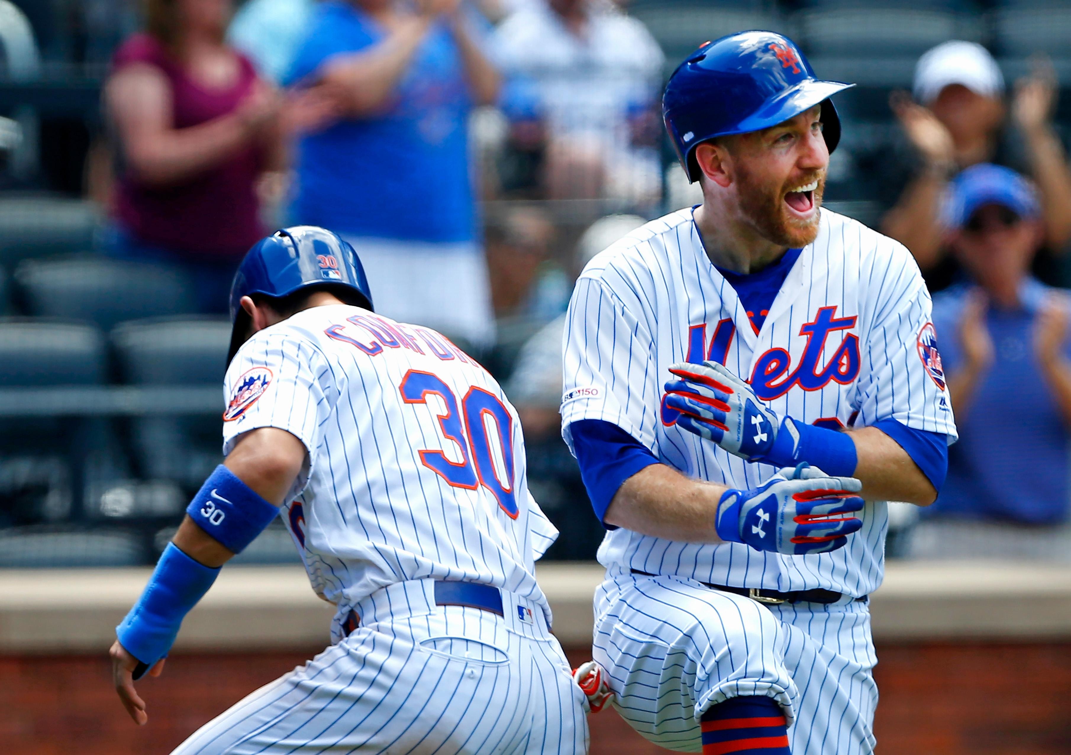 Jun 6, 2019; New York City, NY, USA; New York Mets third baseman Todd Frazier (21) celebrates with right fielder Michael Conforto (30) after hitting a home run against the San Francisco Giants in the eighth inning at Citi Field. Mandatory Credit: Noah K. Murray-USA TODAY Sports