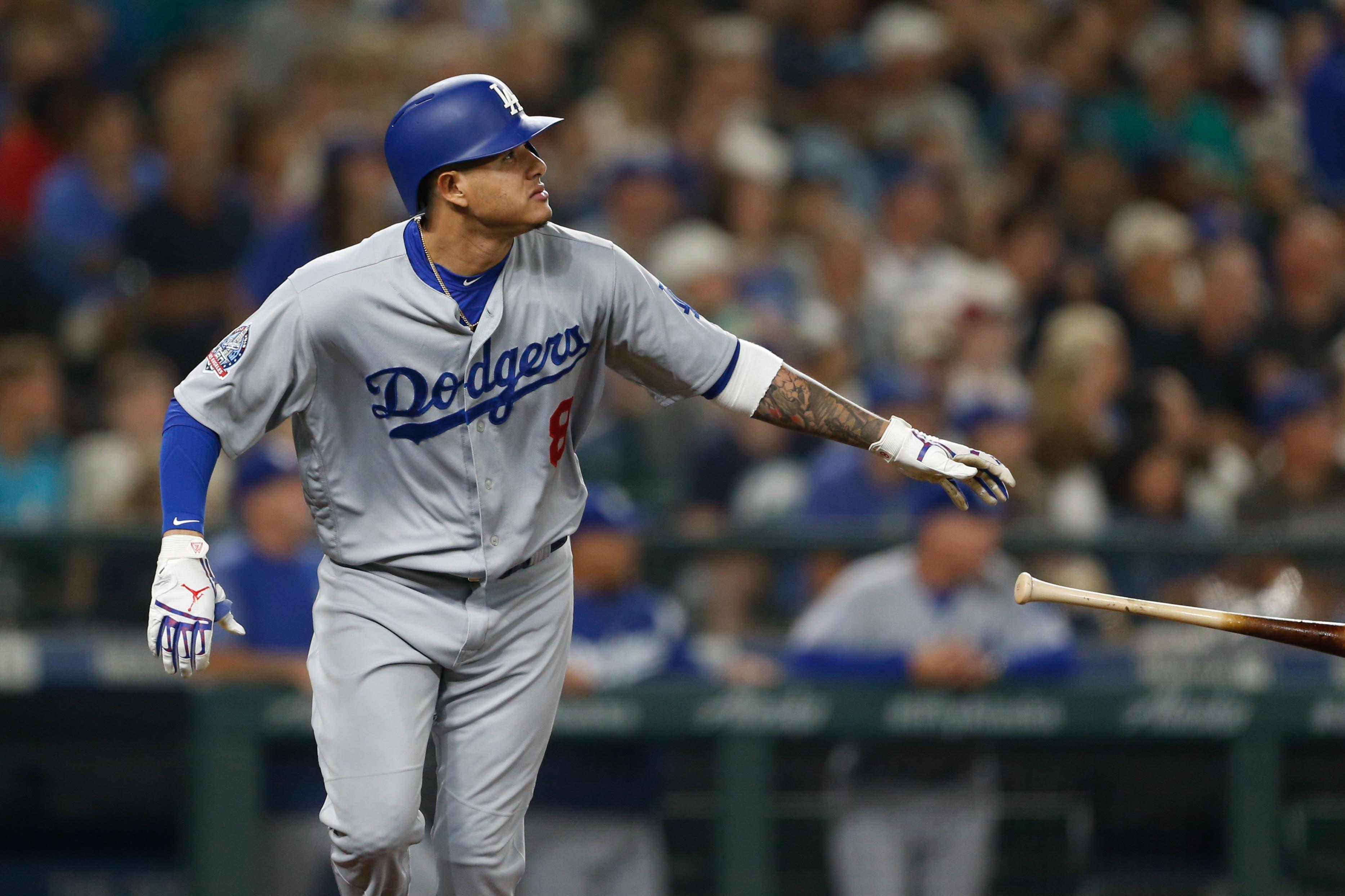 Aug 17, 2018; Seattle, WA, USA; Los Angeles Dodgers shortstop Manny Machado (8) tosses his bat after hitting a home run against the Seattle Mariners at Safeco Field. Mandatory Credit: Jennifer Buchanan-USA TODAY Sports / Jennifer Buchanan