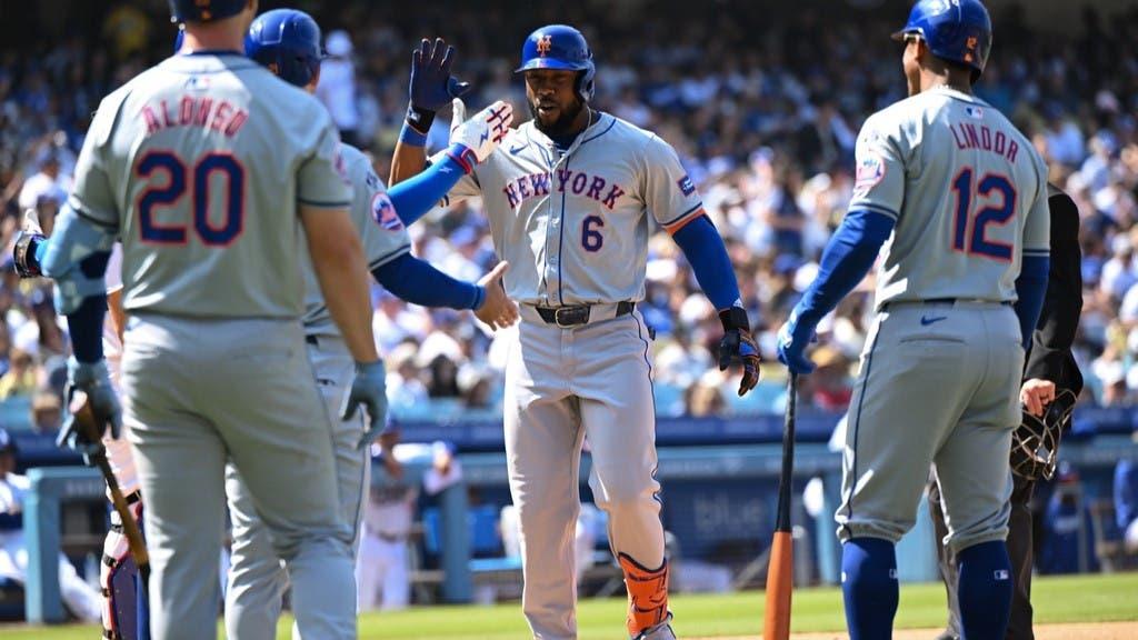 Apr 20, 2024; Los Angeles, California, USA; New York Mets outfielder Starling Marte (6) celebrates with teammates after hitting a home run against the Los Angeles Dodgers during the sixth inning at Dodger Stadium.