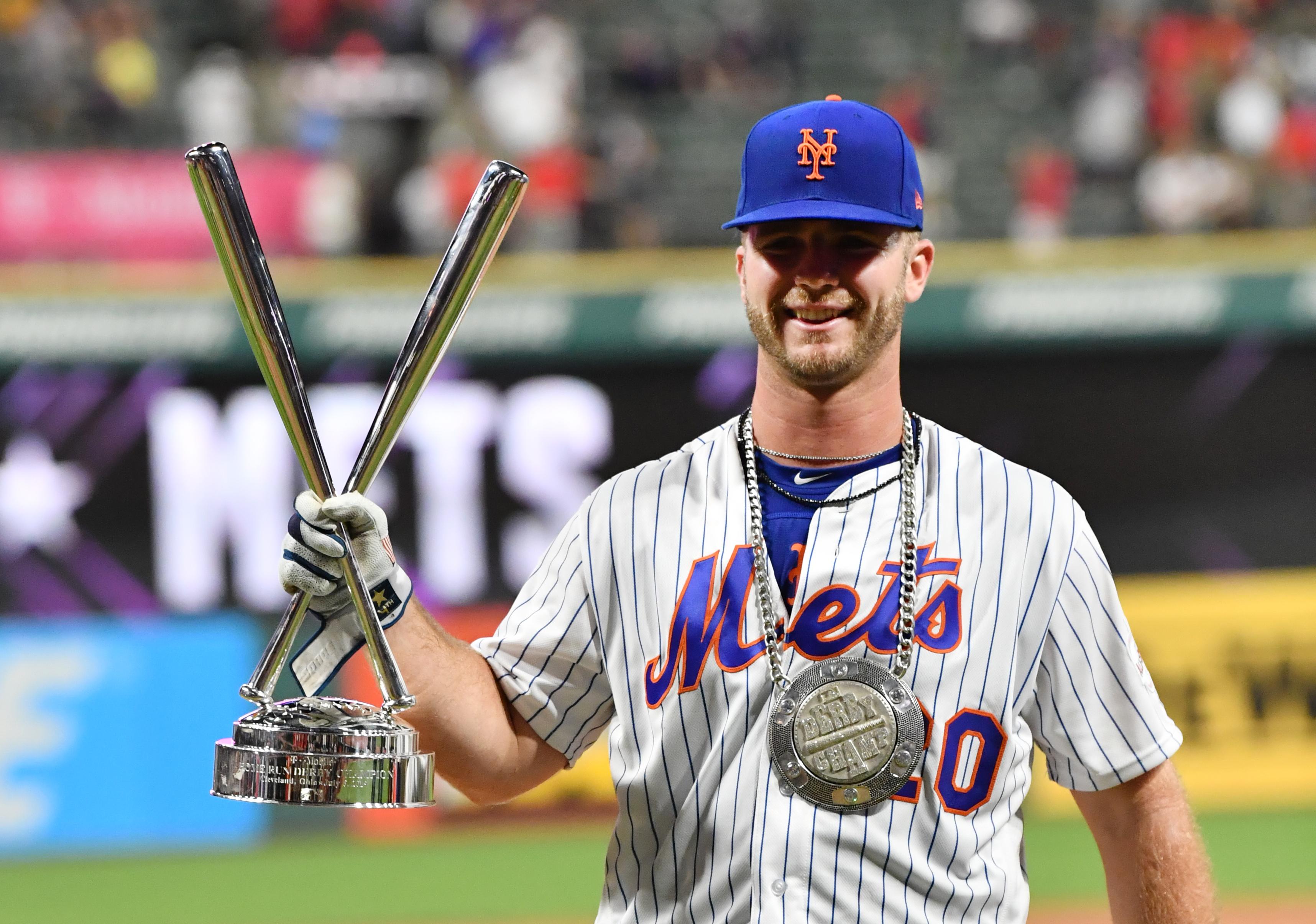 New York Mets first baseman Pete Alonso holds the trophy after winning the 2019 MLB Home Run Derby at Progressive Field.