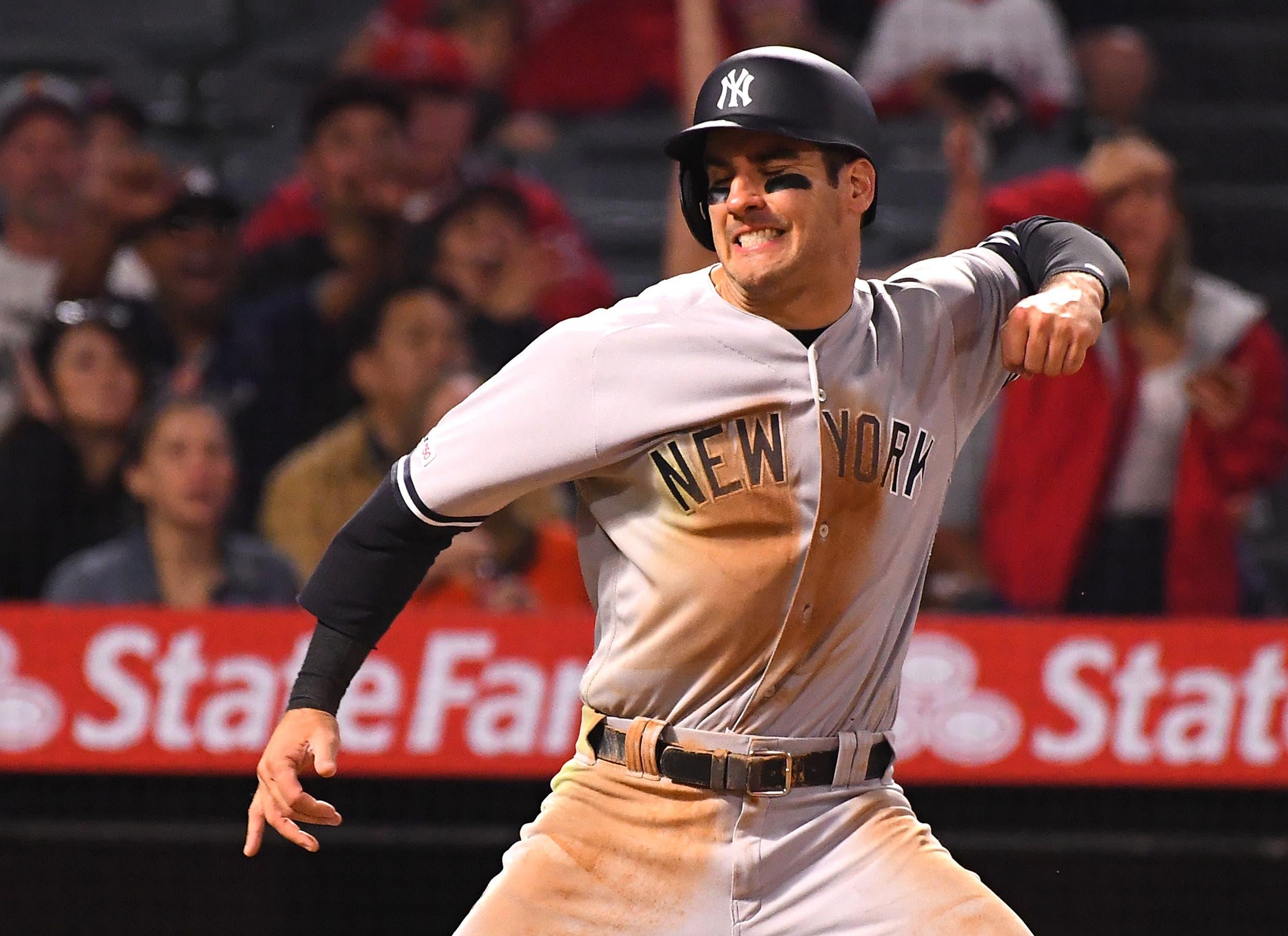 Apr 24, 2019; Anaheim, CA, USA; New York Yankees center fielder Mike Tauchman (39) is safe at home as he avoids a tag by Los Angeles Angels catcher Jonathan Lucroy (not pictured) for a run in the seventh inning of the game at Angel Stadium of Anaheim. Mandatory Credit: Jayne Kamin-Oncea-USA TODAY Sports / Jayne Kamin-Oncea