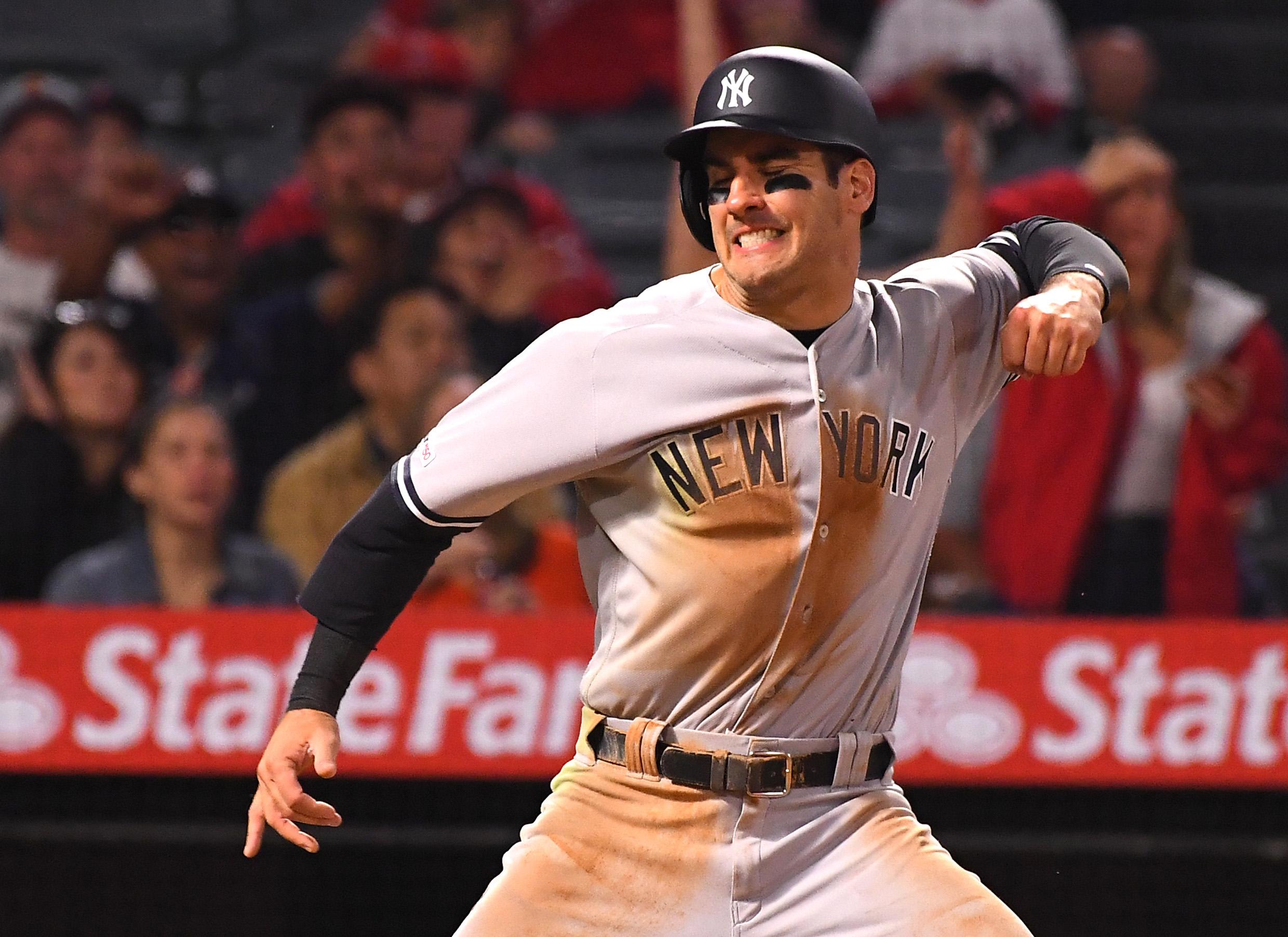 Apr 24, 2019; Anaheim, CA, USA; New York Yankees center fielder Mike Tauchman (39) is safe at home as he avoids a tag by Los Angeles Angels catcher Jonathan Lucroy (not pictured) for a run in the seventh inning of the game at Angel Stadium of Anaheim. Mandatory Credit: Jayne Kamin-Oncea-USA TODAY Sports 