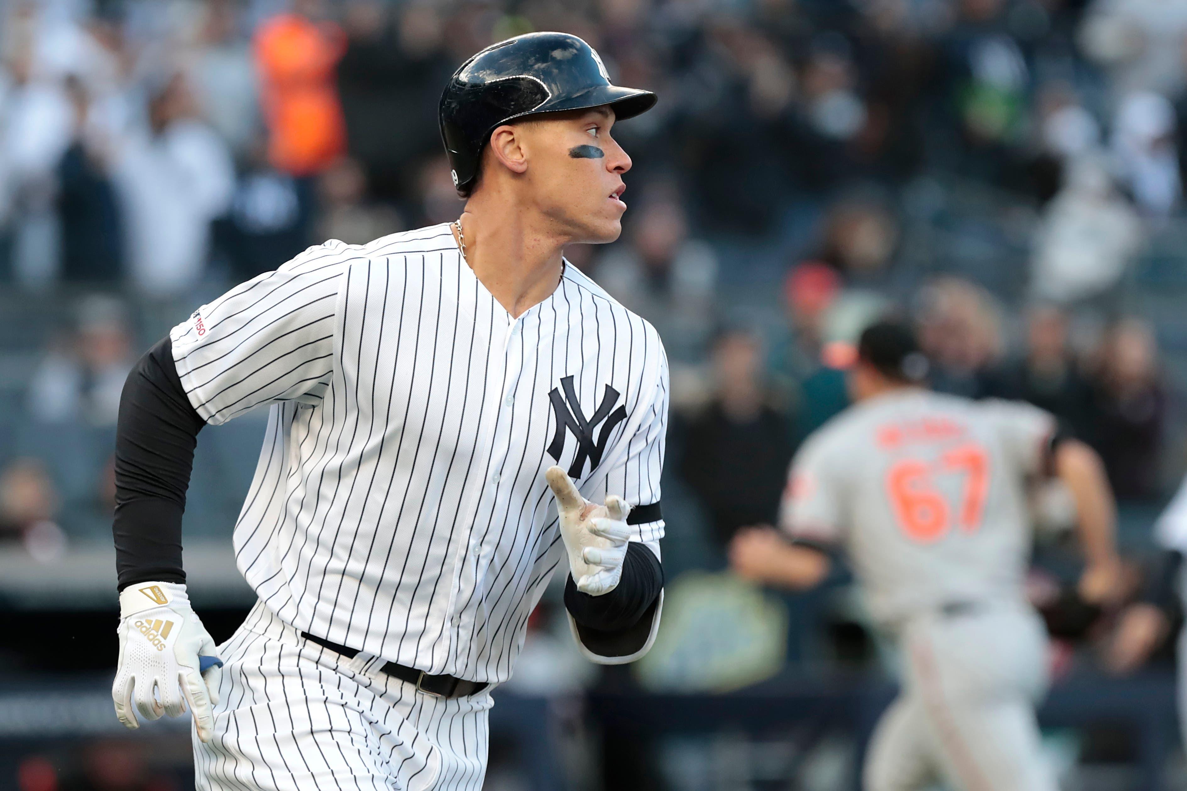 New York Yankees right fielder Aaron Judge runs to first base after hitting a two-run single against the Baltimore Orioles during the fourth inning at Yankee Stadium. / Vincent Carchietta/USA TODAY Sports