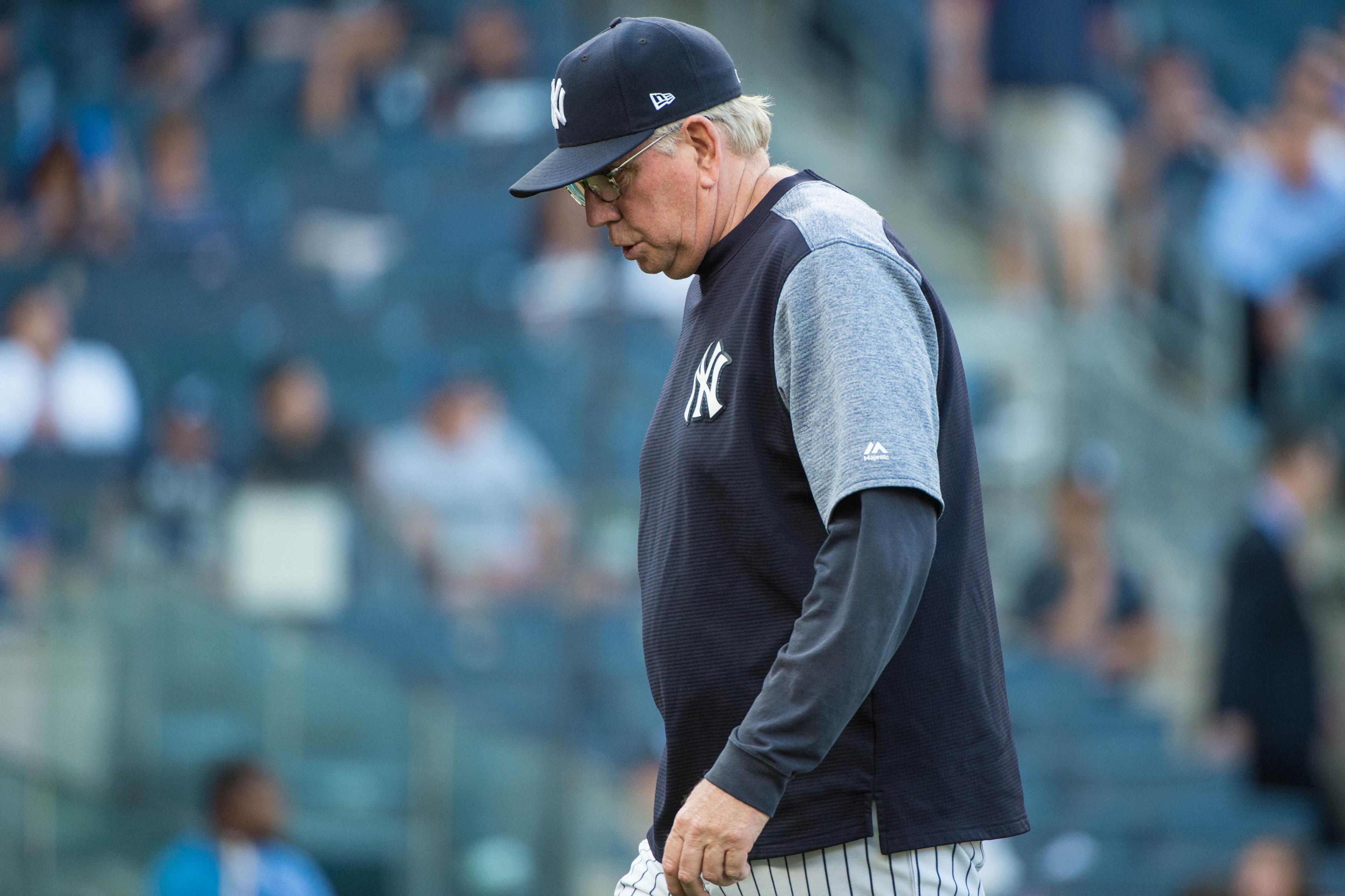 Aug 30, 2017; New York, NY, USA; New York Yankees pitching coach Larry Rothschild (58) returns to the dugout after a visit to the mound during the first inning against the Cleveland Indians at Yankees Stadium. Mandatory Credit: Gregory J. Fisher-USA TODAY Sports / Gregory Fisher