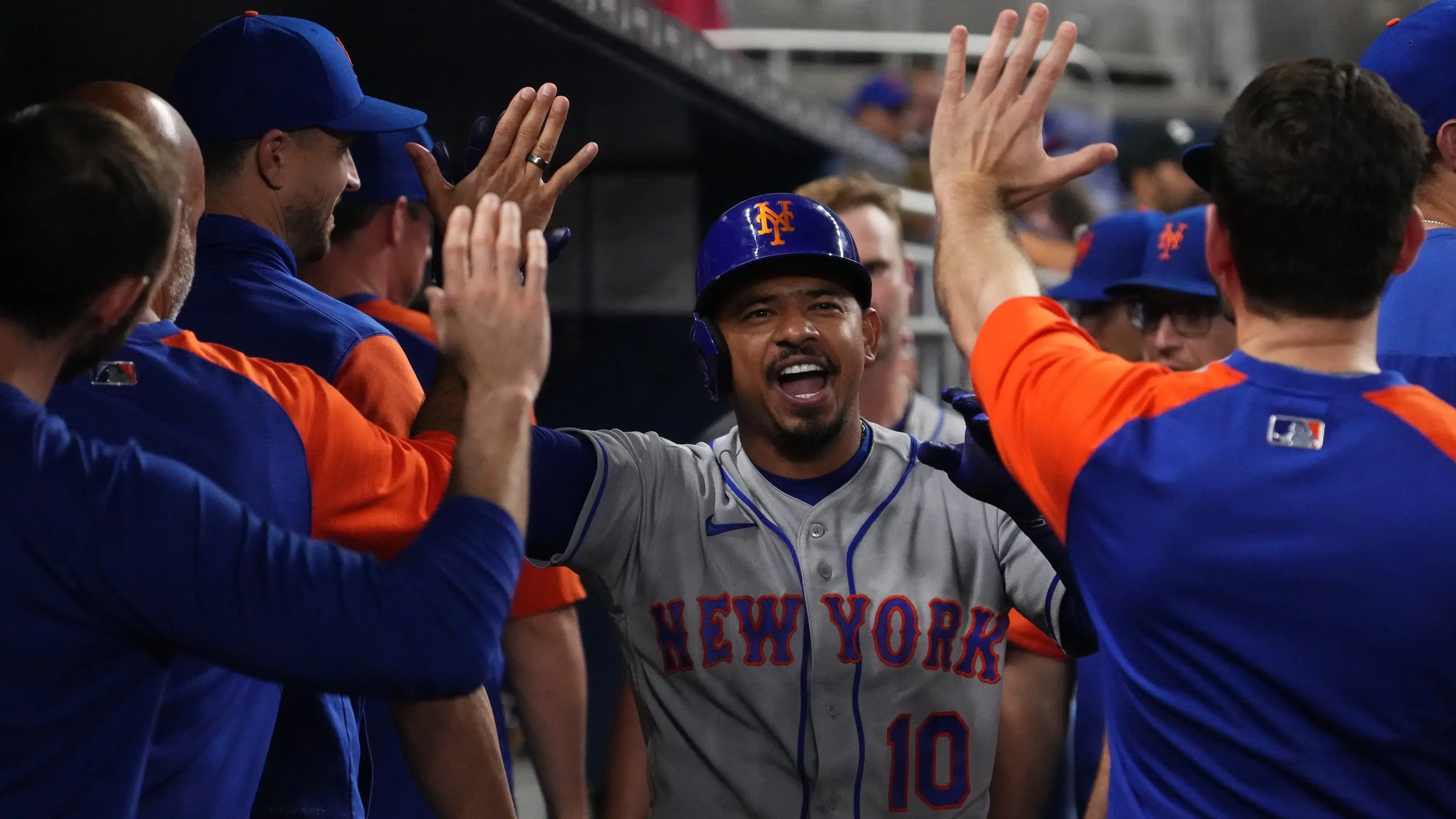 Sep 10, 2022; Miami, Florida, USA; New York Mets third baseman Eduardo Escobar (10) celebrates in the dugout after his solo home run in the seventh inning against the Miami Marlins at loanDepot park. / Jasen Vinlove-USA TODAY Sports