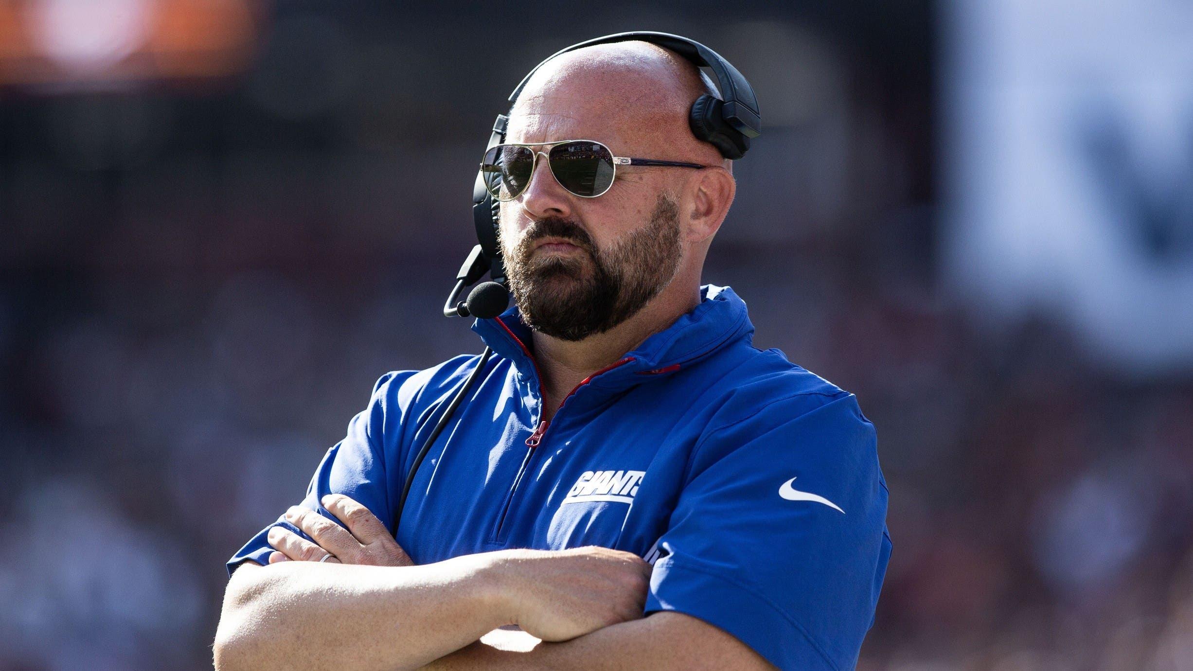 New York Giants head coach Brian Daboll stands on the sideline in the second half against the Washington Commanders.