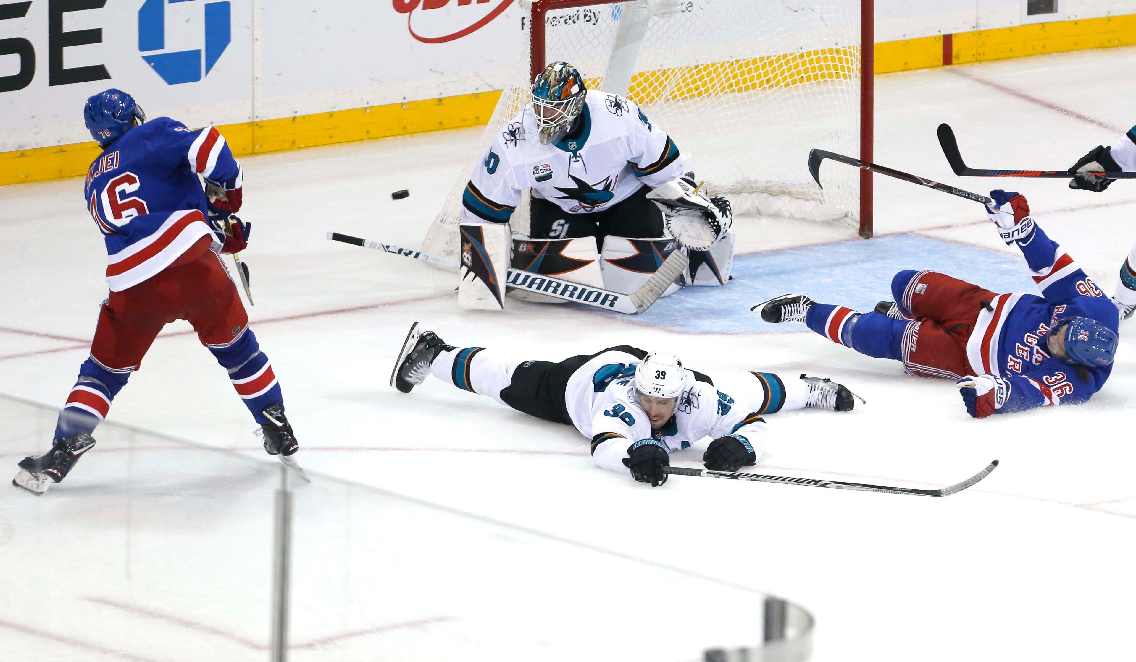 Oct 11, 2018; New York, NY, USA; New York Rangers defenseman Brady Skjei (76) scores the winning goal against San Jose Sharks goaltender Aaron Dell (30) in overtime at Madison Square Garden. The New York Rangers won 3-2 .Mandatory Credit: Noah K. Murray-USA TODAY Sports / Noah K. Murray