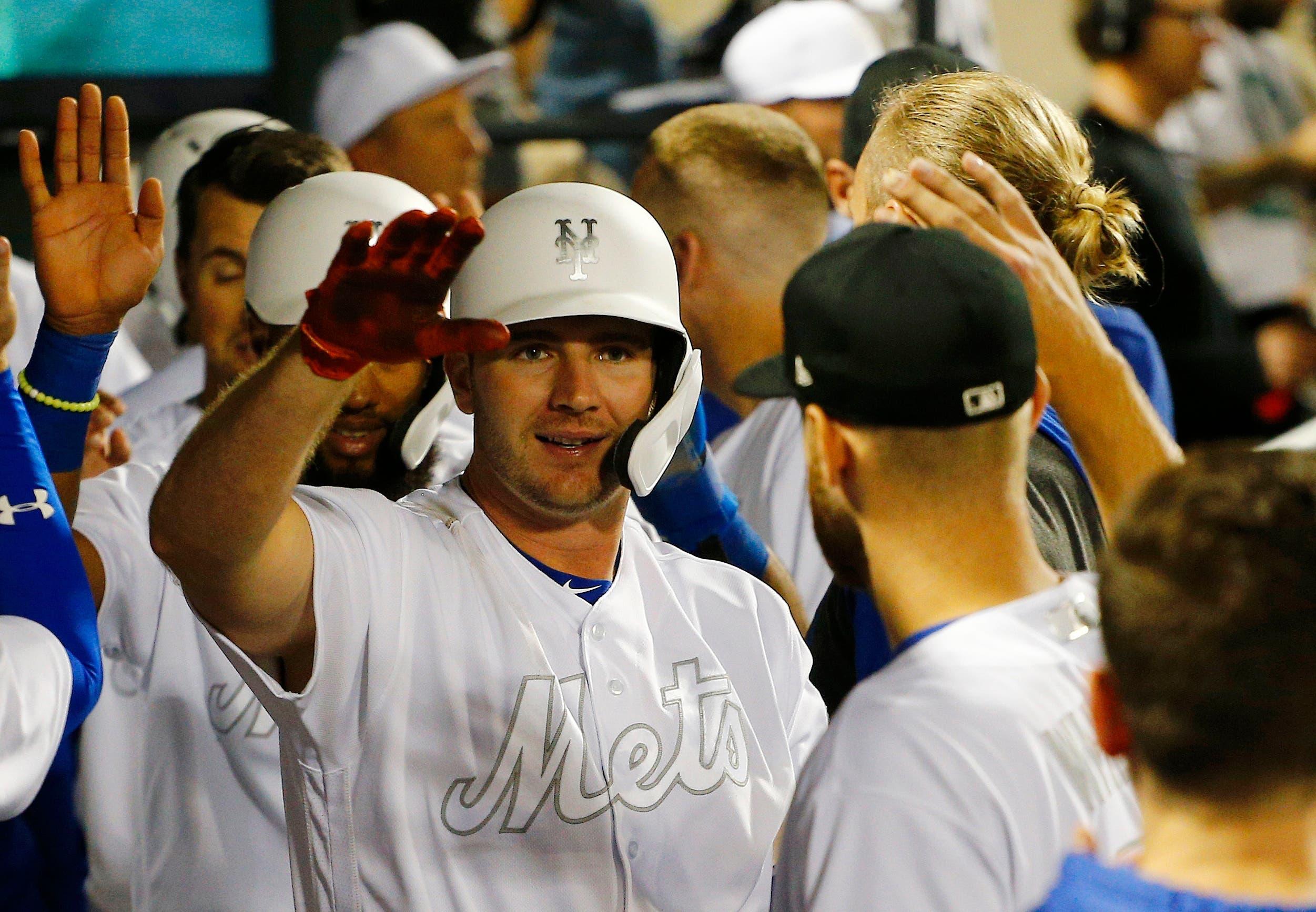 Aug 24, 2019; New York City, NY, USA; New York Mets first baseman Pete Alonso (20) is congratulated after hitting a a three run home run against the Atlanta Braves during the fifth inning of an MLB Players' Weekend game at Citi Field. Mandatory Credit: Andy Marlin-USA TODAY Sports / Andy Marlin