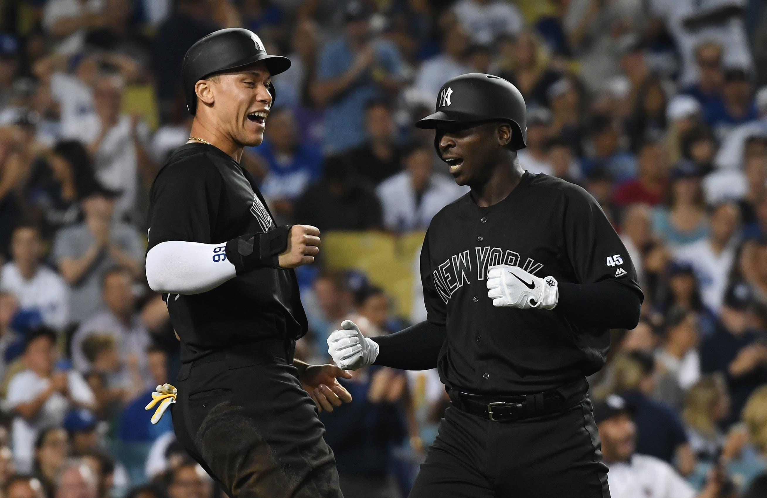 Aug 23, 2019; Los Angeles, CA, USA; New York Yankees right fielder Aaron Judge (99) celebrates after shortstop Didi Gregorius (18) hit a grand slam home run in the fifth inning against the Los Angeles Dodgers during an MLB Players' Weekend game at Dodger Stadium. Mandatory Credit: Richard Mackson-USA TODAY Sports / Richard Mackson