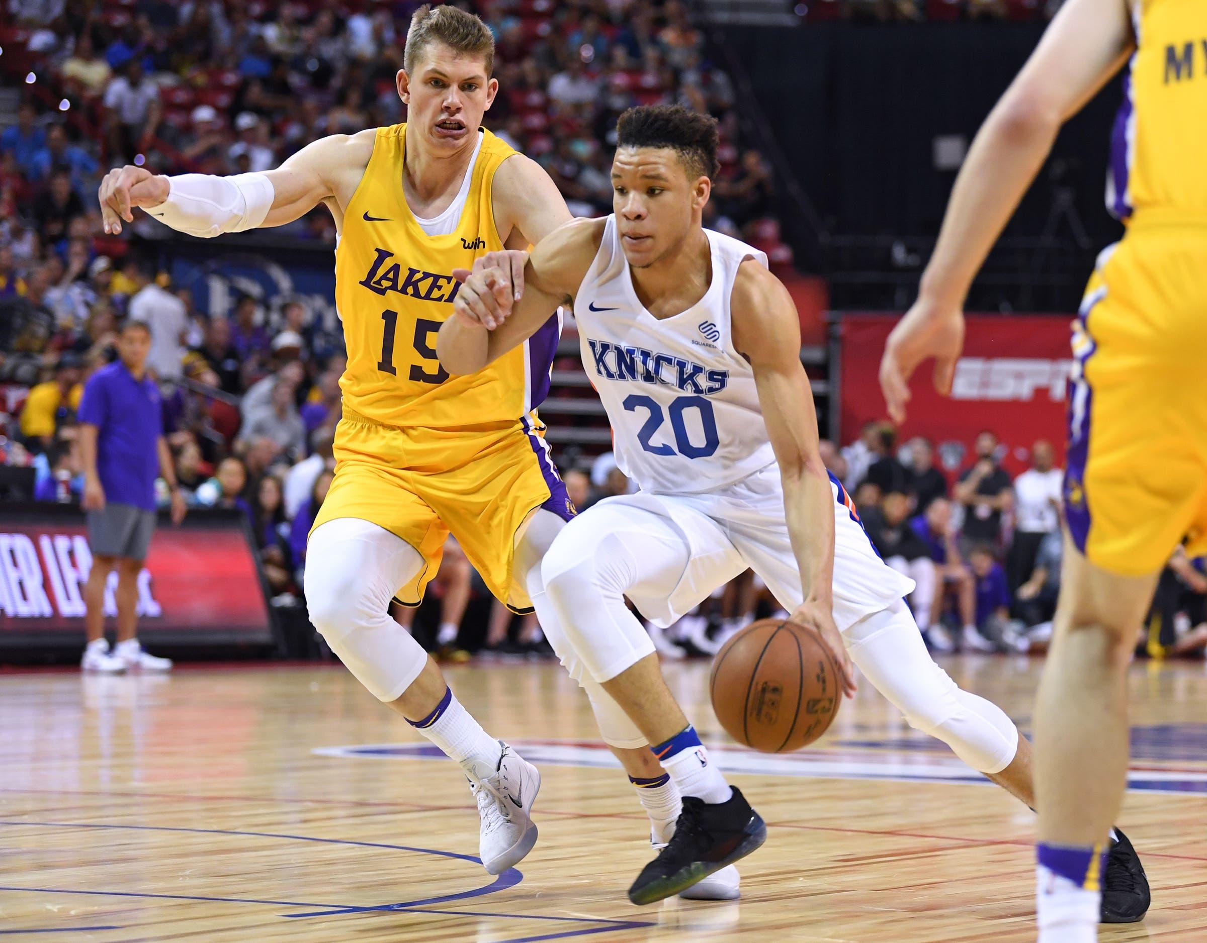 Jul 10, 2018; Las Vegas, NV, USA; New York Knicks forward Kevin Knox (20) dribbles inside Los Angeles Lakers center Moritz Wagner (15) during the first half at Thomas & Mack Center. Mandatory Credit: Stephen R. Sylvanie-USA TODAY Sports / Stephen R. Sylvanie