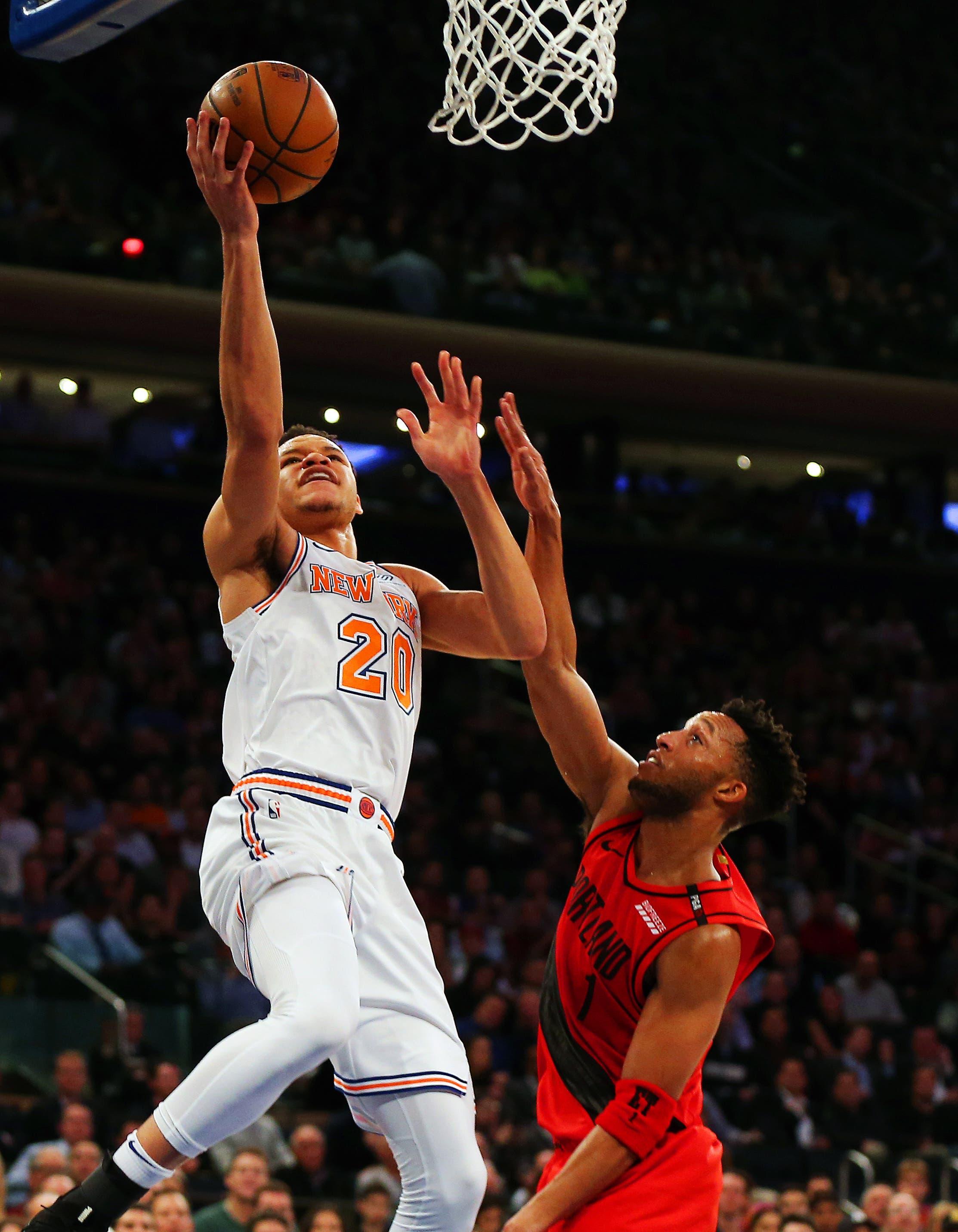 New York Knicks forward Kevin Knox shoots against Portland Trail Blazers guard Evan Turner during the first half at Madison Square Garden. / Andy Marlin/USA TODAY Sports