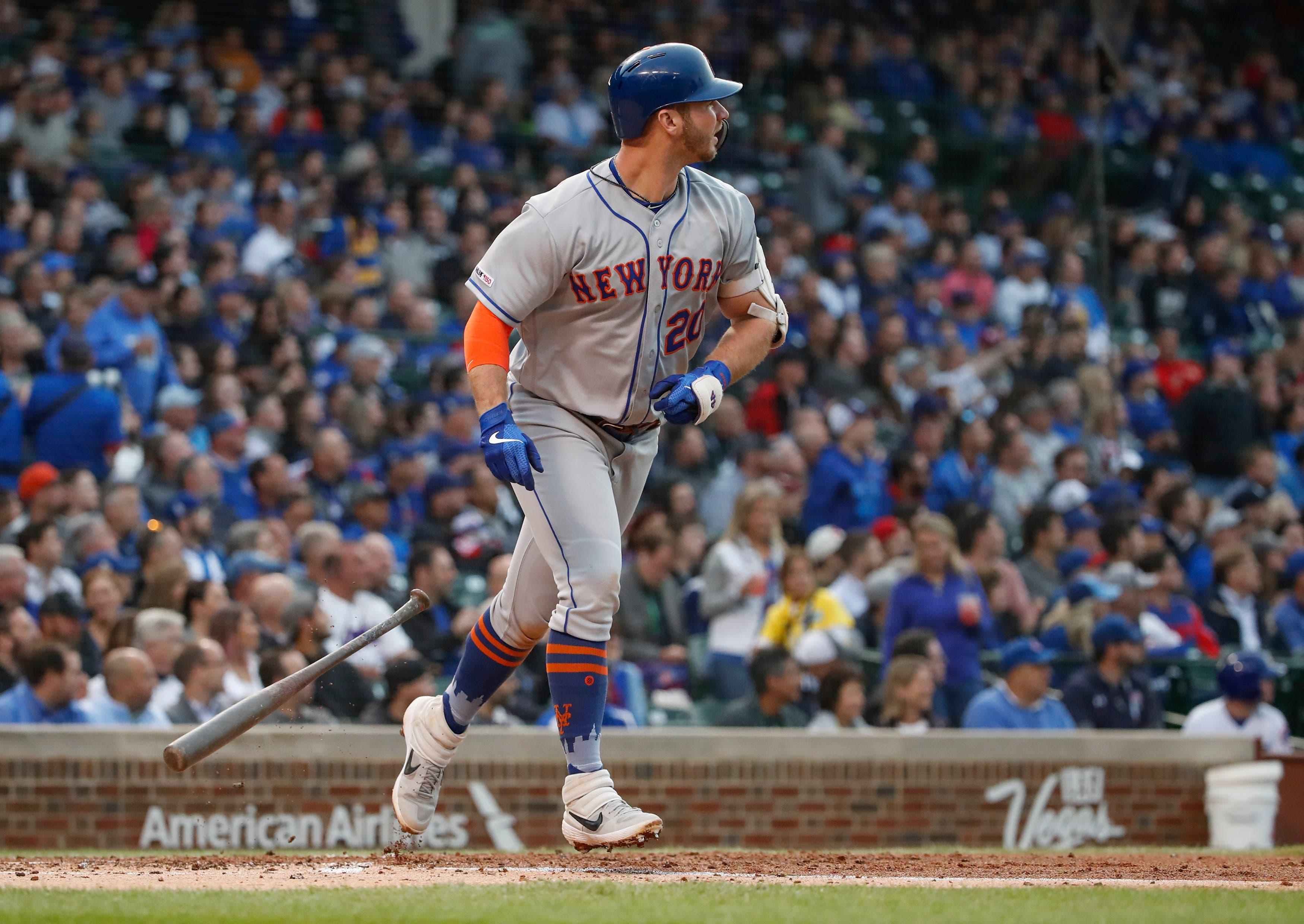 Jun 20, 2019; Chicago, IL, USA; New York Mets first baseman Pete Alonso (20) watches his two run home run against the Chicago Cubs during the third inning at Wrigley Field. Mandatory Credit: Kamil Krzaczynski-USA TODAY Sports / Kamil Krzaczynski