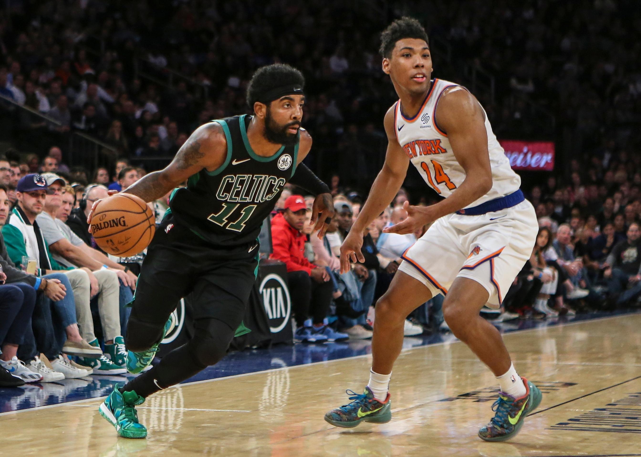 Boston Celtics guard Kyrie Irving drives past New York Knicks guard Alonzo Trier in the fourth quarter during the Celtics 103-101 victory at Madison Square Garden.