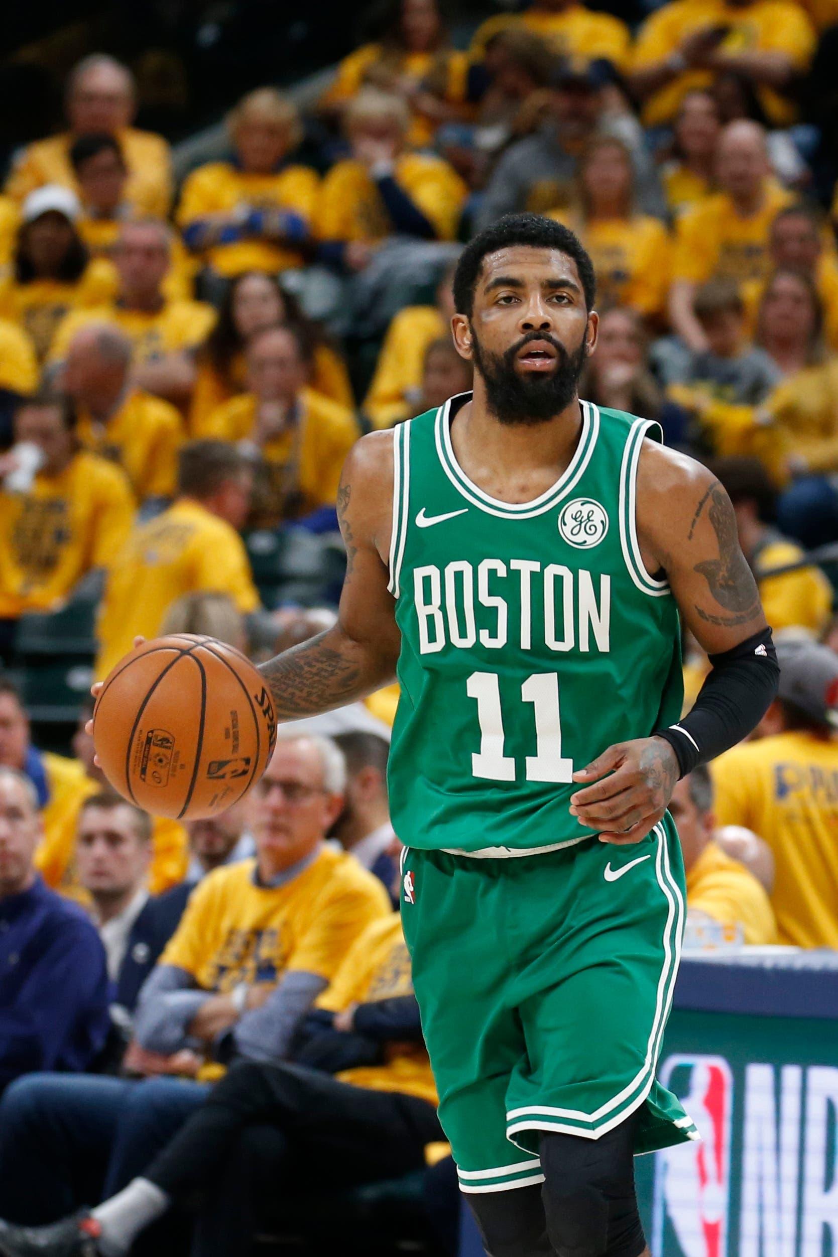 Boston Celtics guard Kyrie Irving brings the ball up court against the Indiana Pacers during the third quarter in Game 3 of the first round of the 2019 NBA Playoffs at Bankers Life Fieldhouse. / Brian Spurlock/USA TODAY Sports