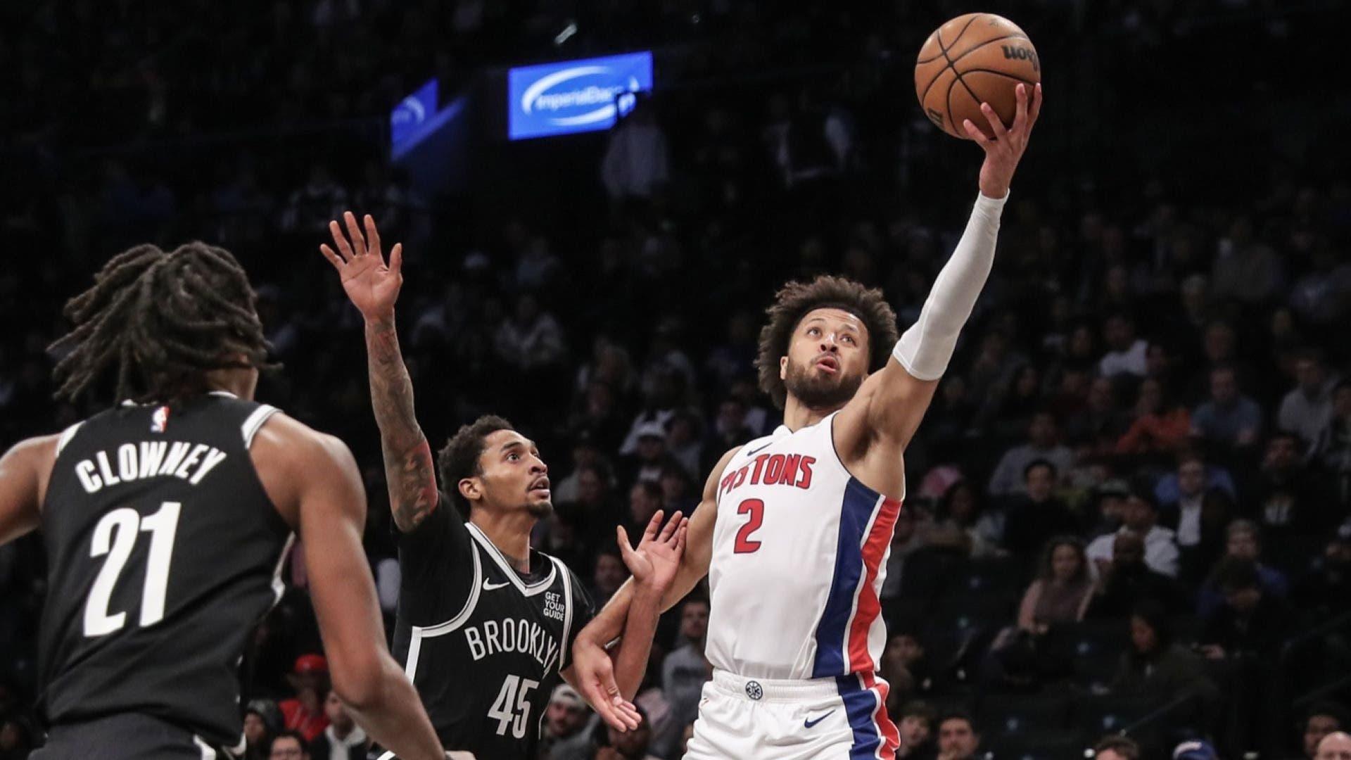 Nov 3, 2024; Brooklyn, New York, USA; Detroit Pistons guard Cade Cunningham (2) catches a pass in front of Brooklyn Nets guard Keon Johnson (45) in the second quarter at Barclays Center. / Wendell Cruz-Imagn Images