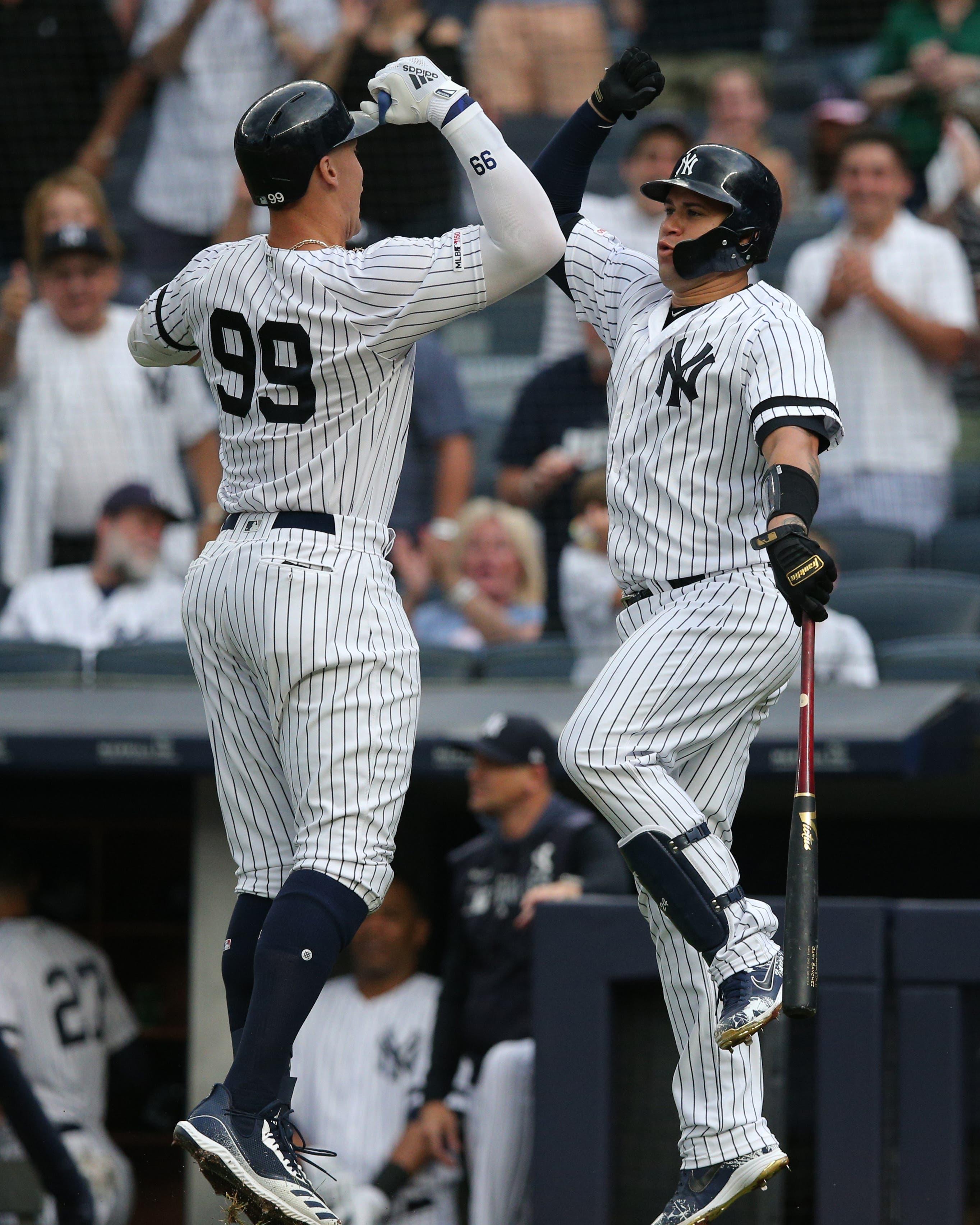 Jun 25, 2019; Bronx, NY, USA; New York Yankees right fielder Aaron Judge (99) celebrates his solo home run against the Toronto Blue Jays with catcher Gary Sanchez (24) during the first inning at Yankee Stadium. Mandatory Credit: Brad Penner-USA TODAY Sports / Brad Penner