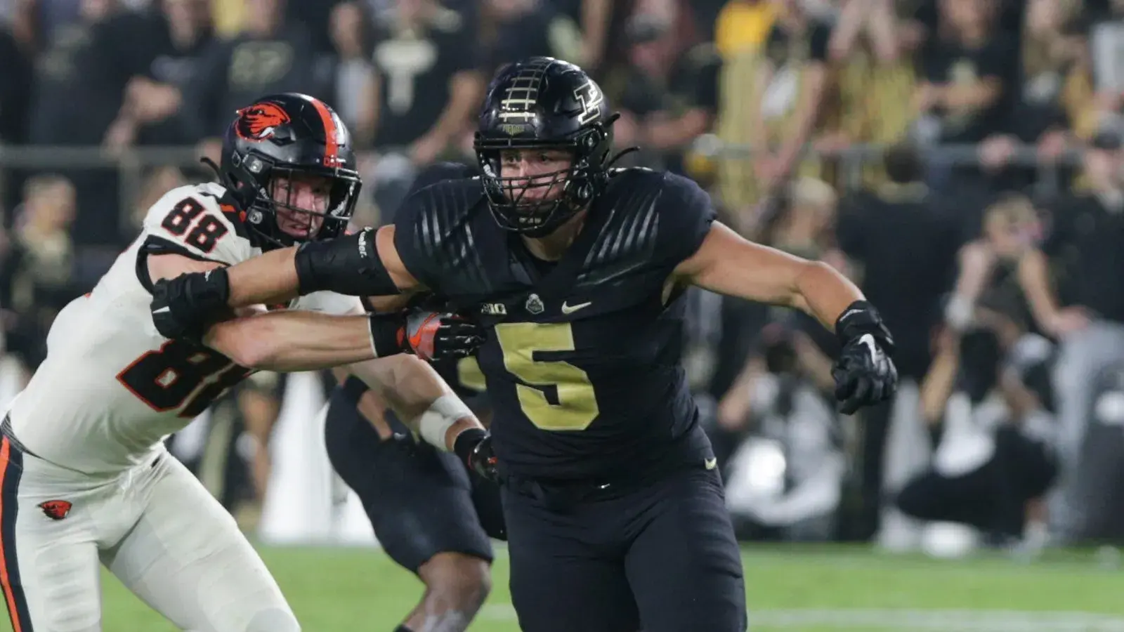 Purdue defensive end George Karlaftis (5) blows past Oregon State tight end Luke Musgrave (88) during the second quarter of an NCAA college football game, Saturday, Sept. 4, 2021 at Ross-Ade Stadium in West Lafayette. Cfb Purdue Vs Oregon State / © Nikos Frazier / Journal & Courier via Imagn Content Services, LLC