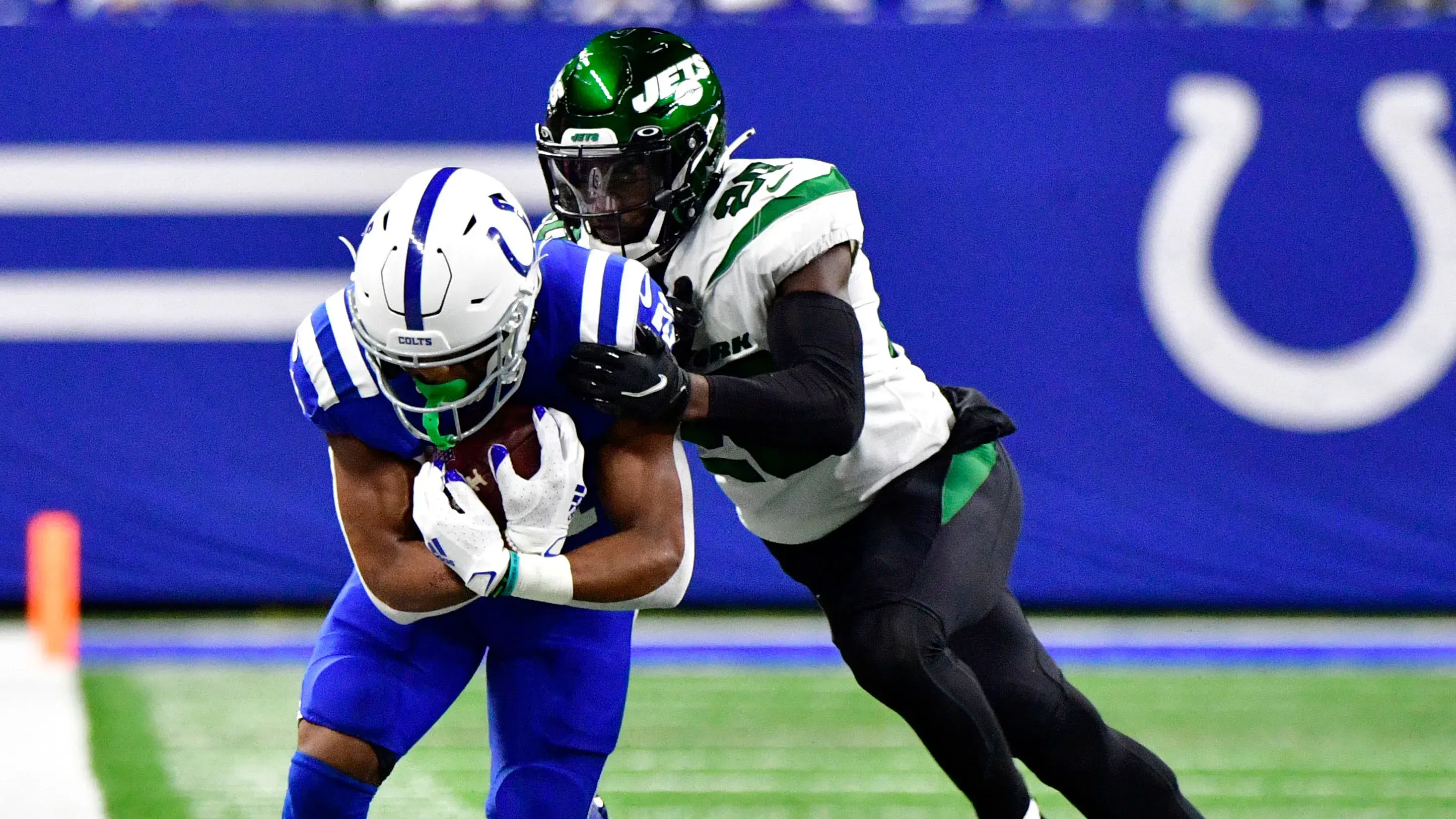 Nov 4, 2021; Indianapolis, Indiana, USA; Indianapolis Colts running back Nyheim Hines (21) is pushed out of bounds by New York Jets free safety Marcus Maye (20) during the first quarter at Lucas Oil Stadium. / Marc Lebryk-USA TODAY Sports