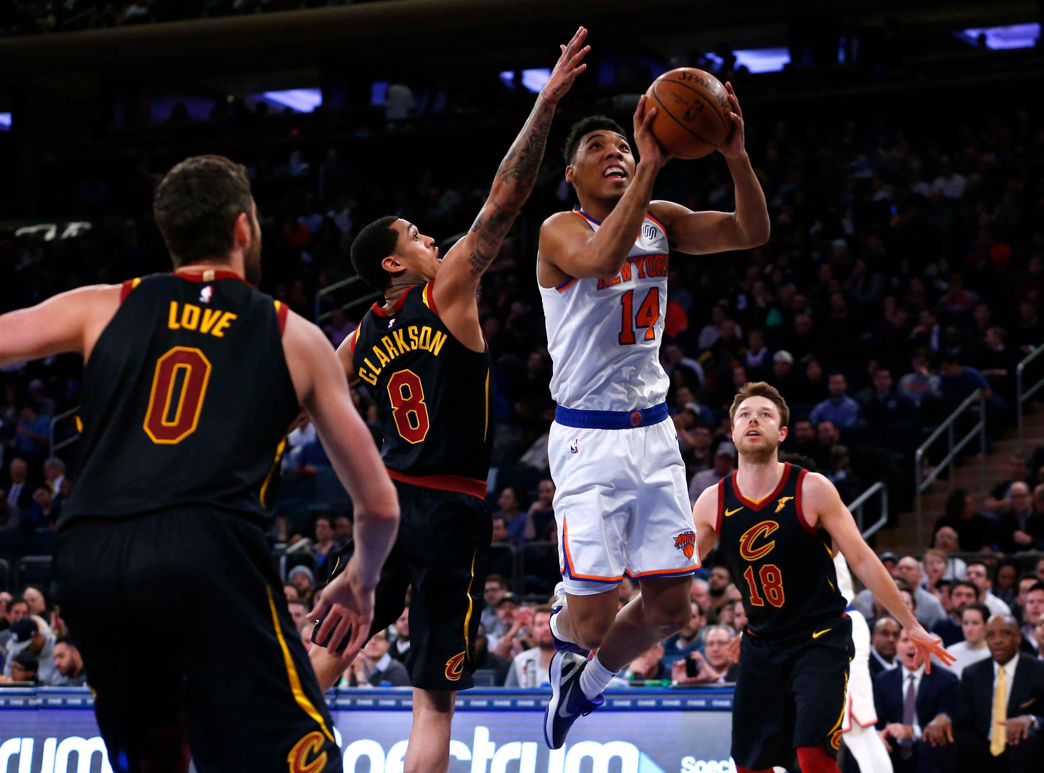 Feb 28, 2019; New York, NY, USA; New York Knicks guard Allonzo Trier (14) goes to the basket against Cleveland Cavaliers guard Jordan Clarkson (8) and guard Matthew Dellavedova (18) during the first half at Madison Square Garden. Mandatory Credit: Noah K. Murray-USA TODAY Sports / Noah K. Murray