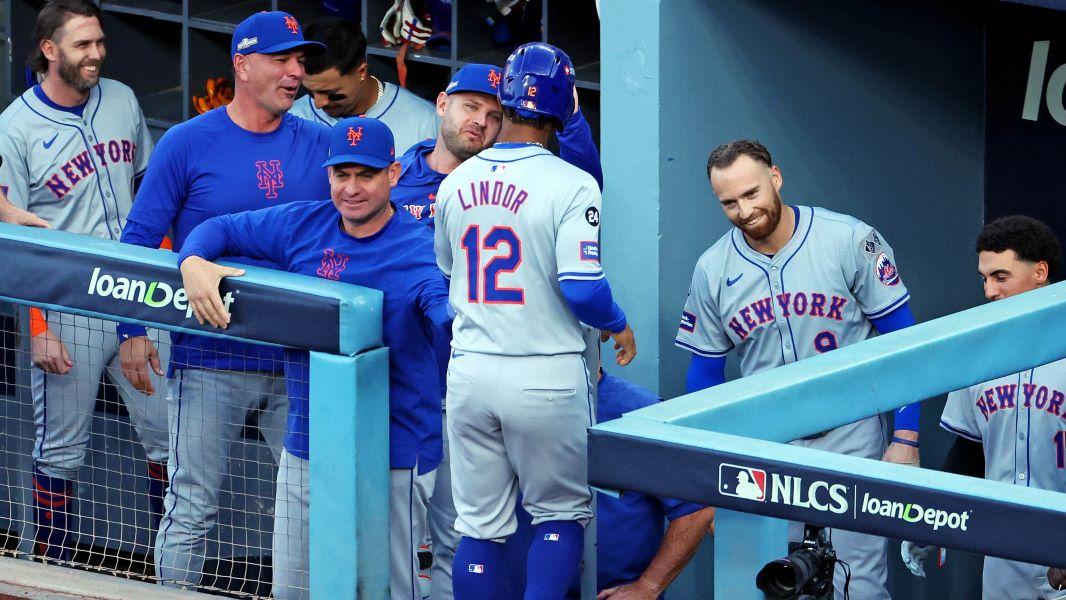 Oct 20, 2024; Los Angeles, California, USA; New York Mets shortstop Francisco Lindor (12) celebrates with his dugout after scoring a run during the first inning against the Los Angeles Dodgers during game six of the NLCS for the 2024 MLB playoffs at Dodger Stadium.