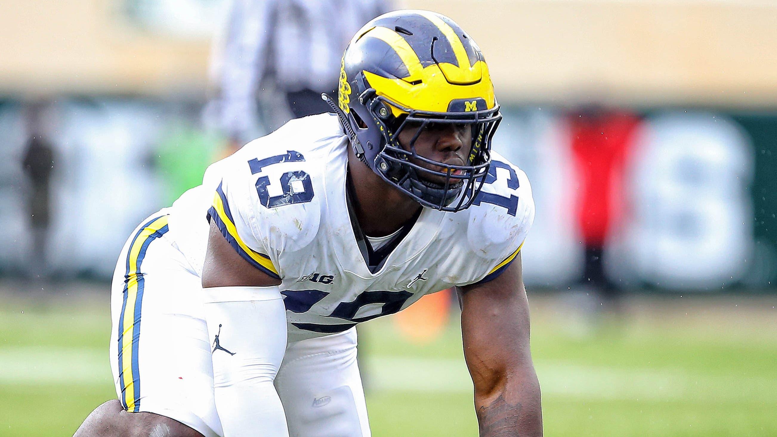 Michigan Wolverines defensive lineman Kwity Paye (19) prepares for the snap of the ball during the second half of a game against the Michigan State Spartans at Spartan Stadium. / USA TODAY Sports