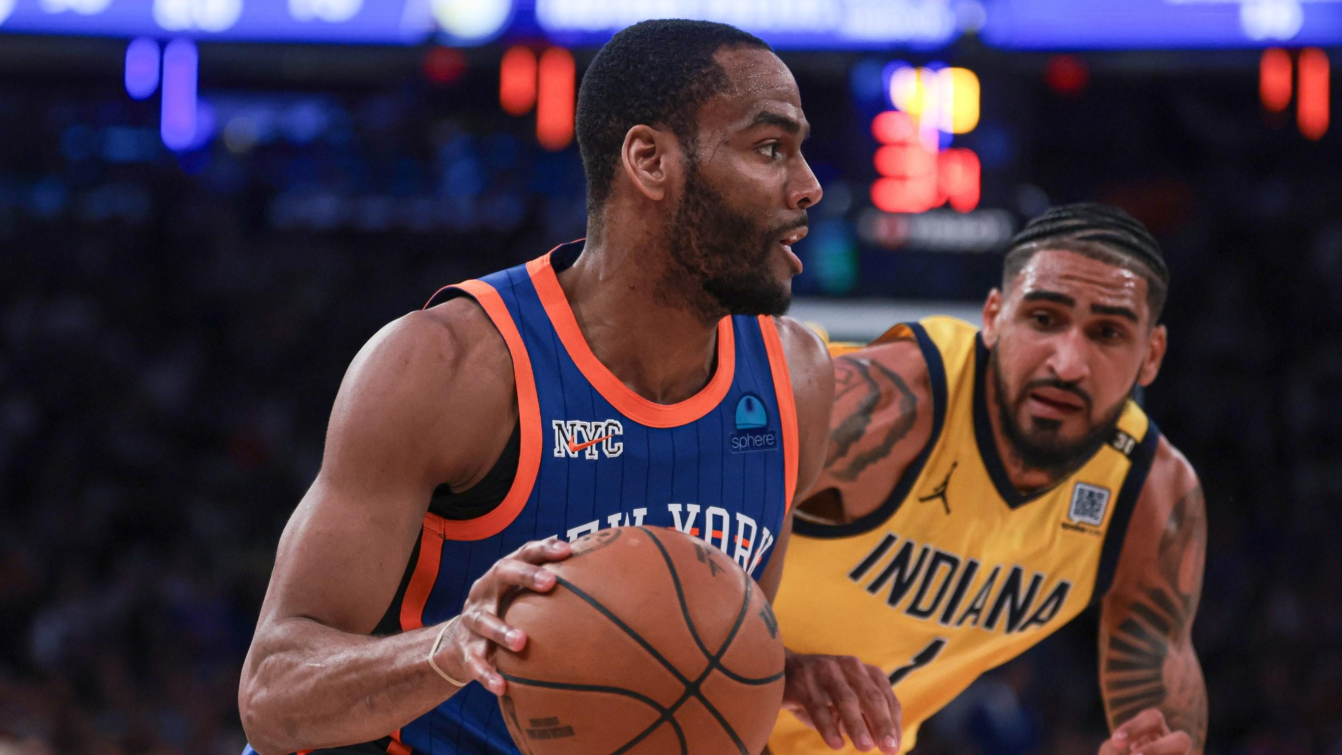 May 14, 2024; New York, New York, USA; New York Knicks guard Alec Burks (18) dribbles against Indiana Pacers forward Obi Toppin (1) during the second half during game five of the second round for the 2024 NBA playoffs at Madison Square Garden.