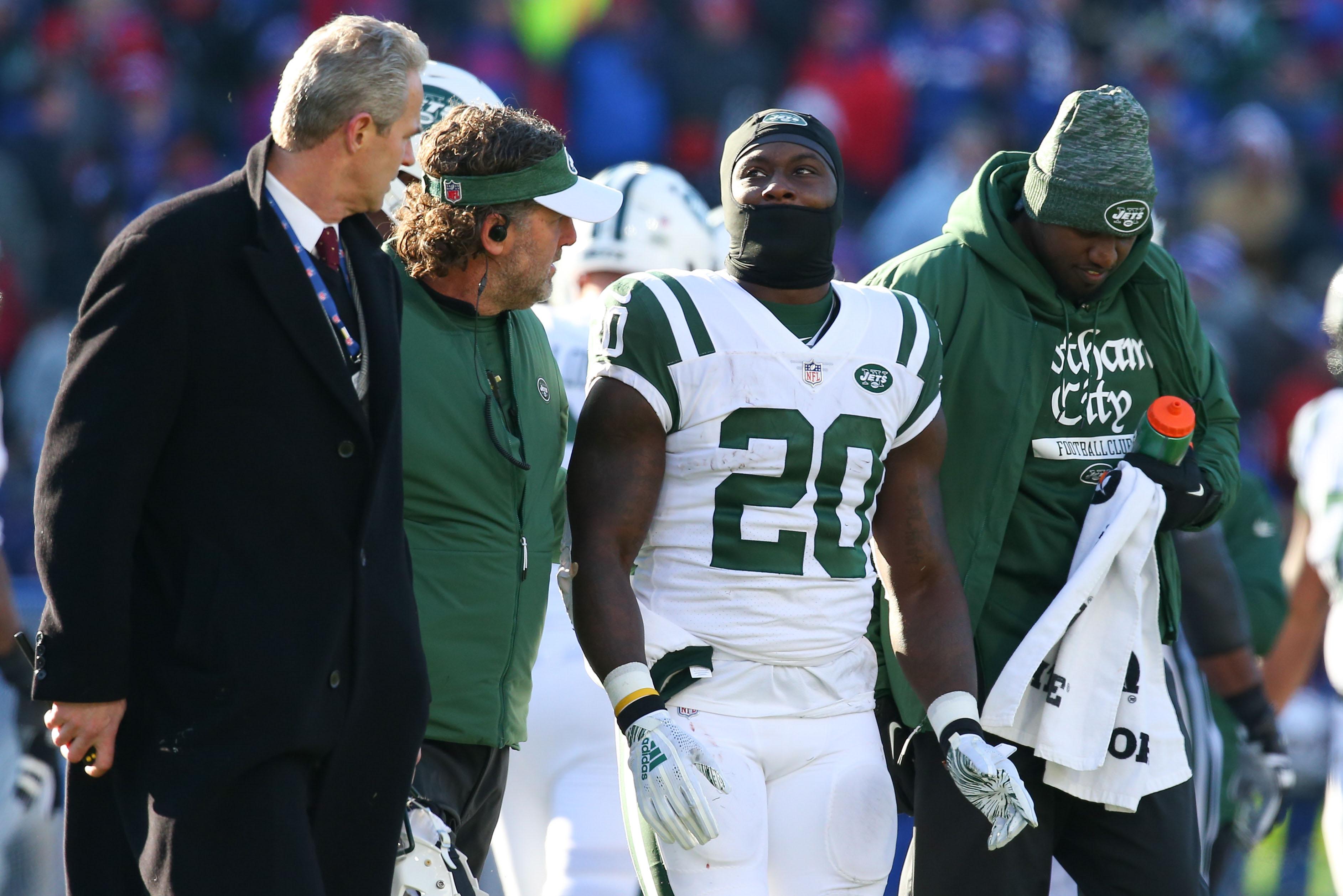 New York Jets running back Isaiah Crowell is escorted off the field after being injured against the Buffalo Bills during the first quarter at New Era Field.