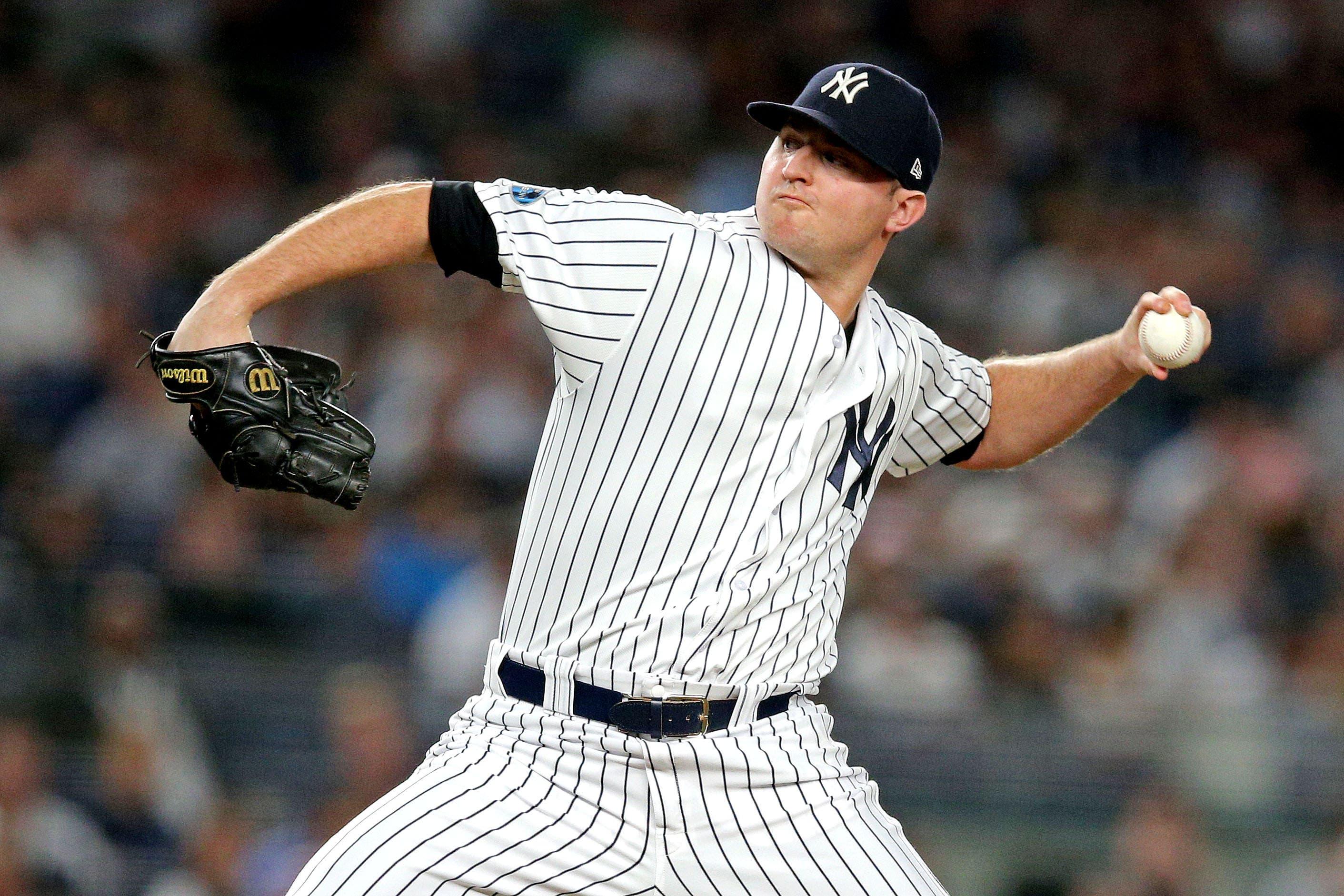 New York Yankees relief pitcher Zach Britton pitches during the fourth inning against the Boston Red Sox in Game 4 of the 2018 ALDS at Yankee Stadium. / Brad Penner/USA TODAY Sports