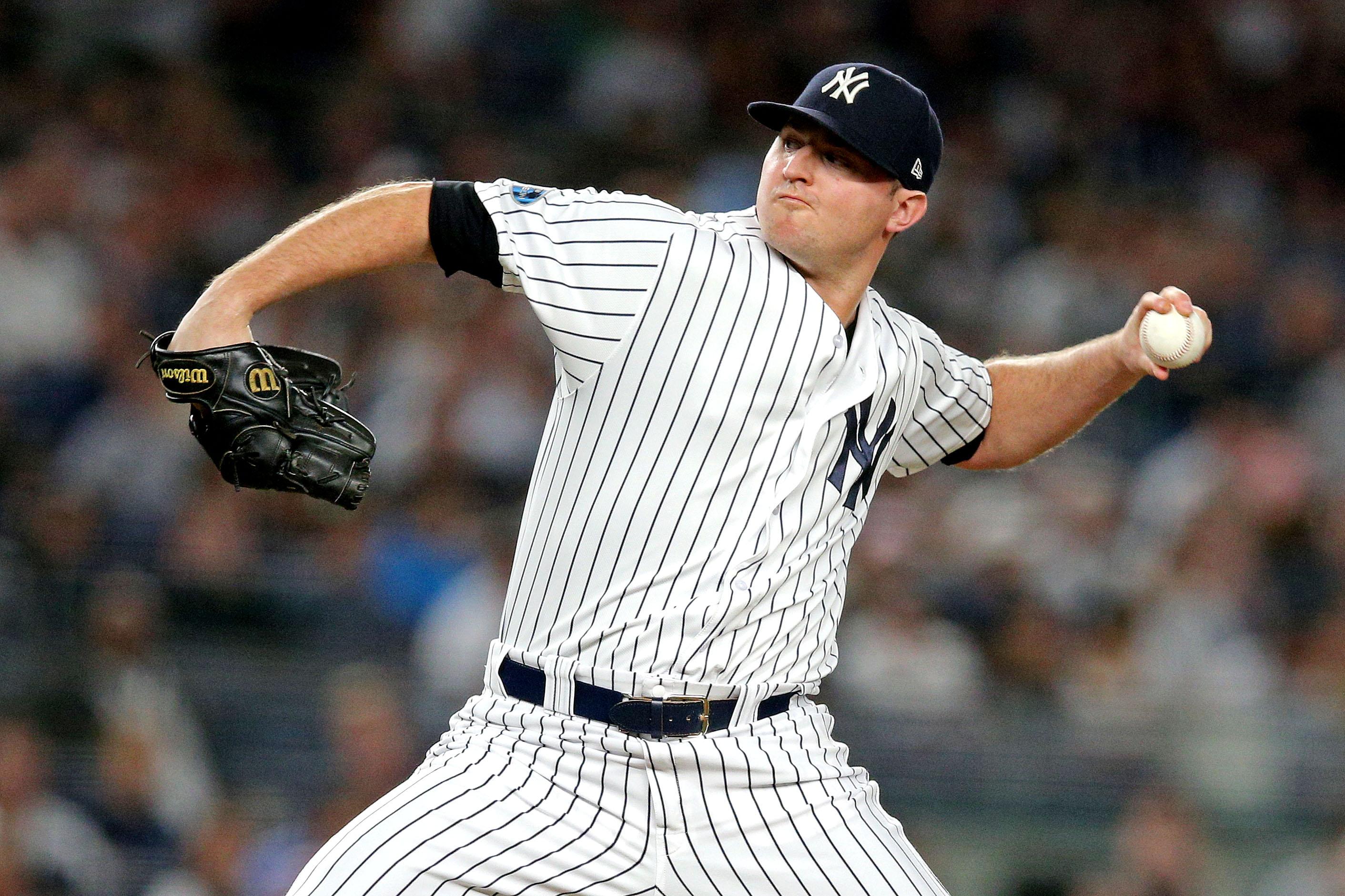 New York Yankees relief pitcher Zach Britton pitches during the fourth inning against the Boston Red Sox in Game 4 of the 2018 ALDS at Yankee Stadium.