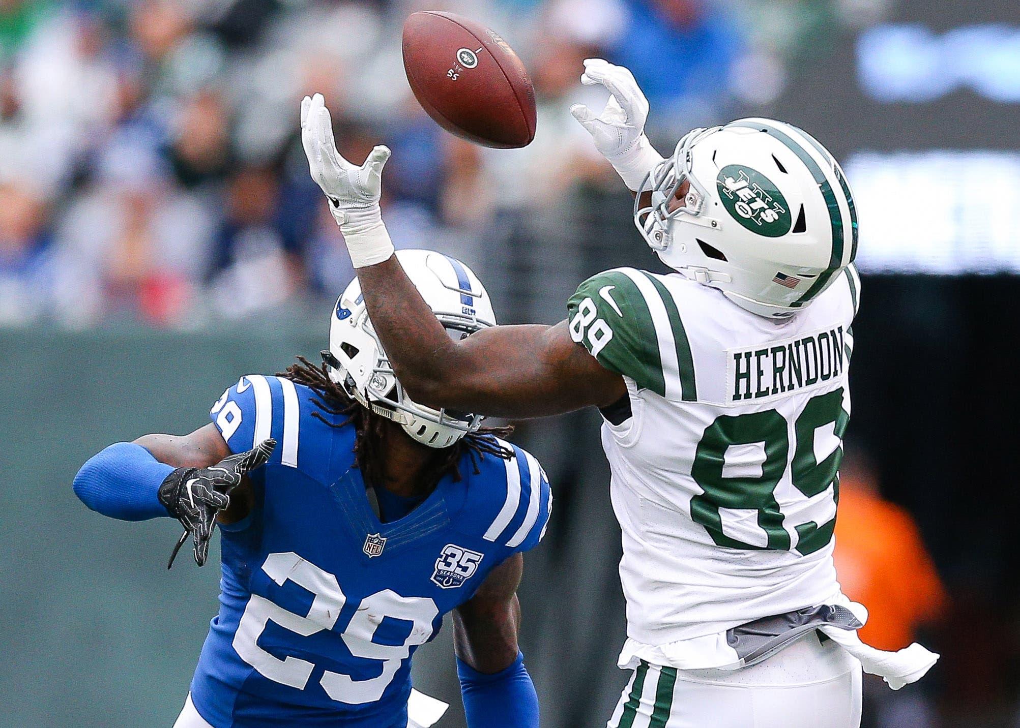 Oct 14, 2018; East Rutherford, NJ, USA; New York Jets tight end Chris Herndon (89) catches a pass over Indianapolis Colts cornerback Chris Milton (28) during the first half at MetLife Stadium. Mandatory Credit: Vincent Carchietta-USA TODAY Sports / Vincent Carchietta