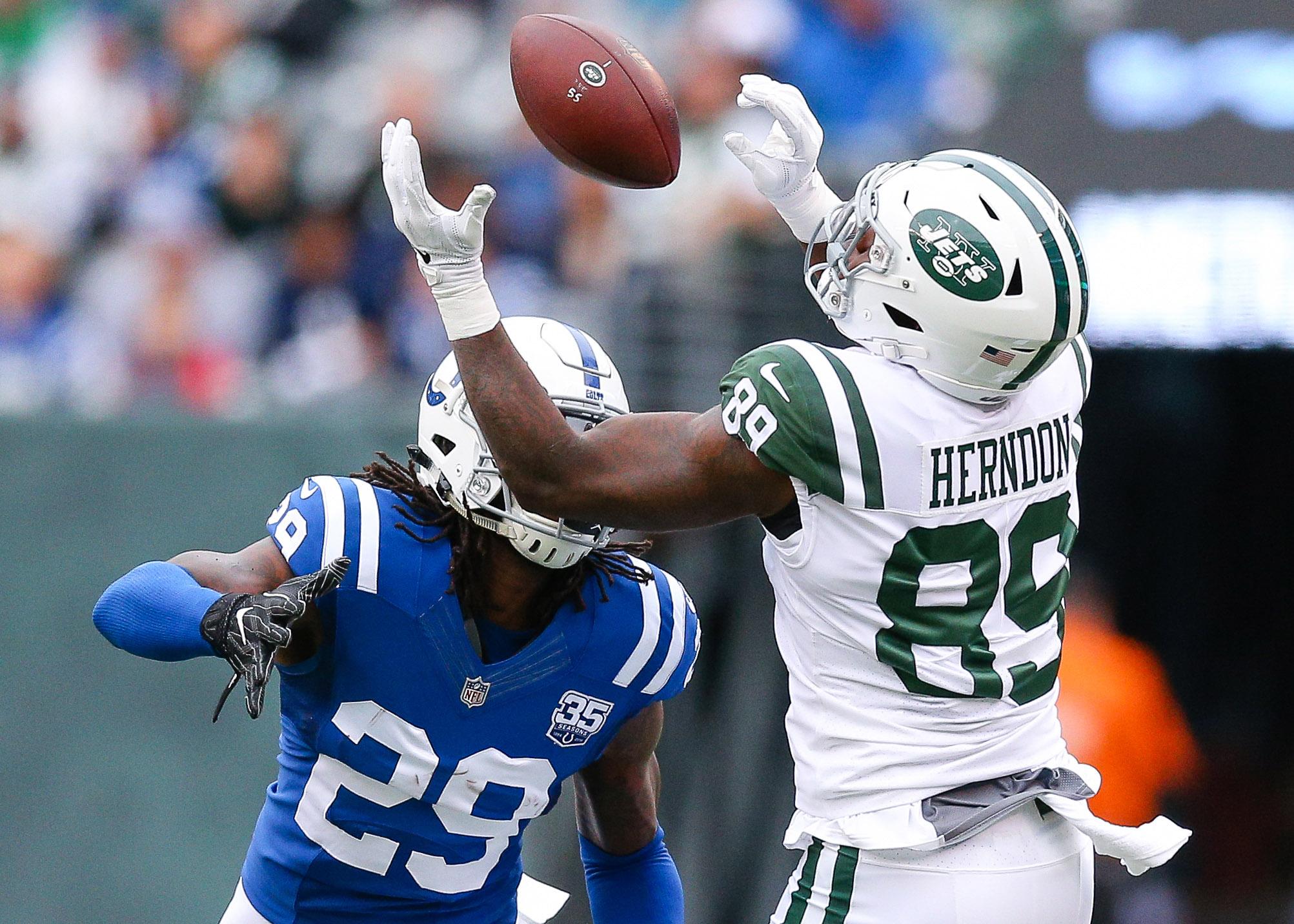 Oct 14, 2018; East Rutherford, NJ, USA; New York Jets tight end Chris Herndon (89) catches a pass over Indianapolis Colts cornerback Chris Milton (28) during the first half at MetLife Stadium. Mandatory Credit: Vincent Carchietta-USA TODAY Sports