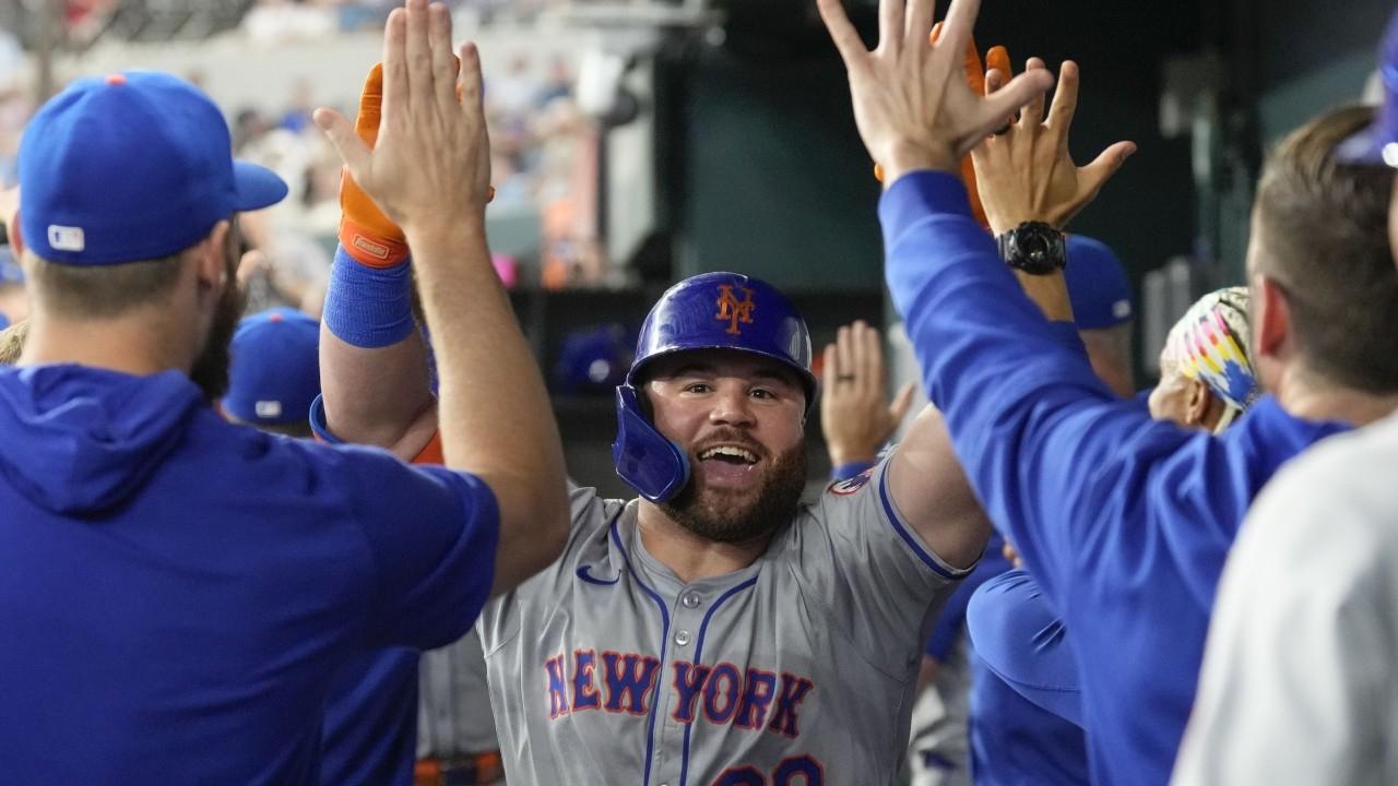 New York Mets right fielder DJ Stewart (29) celebrates his three-run home run with teammates in the dugout during the second inning against the Texas Rangers at Globe Life Field.