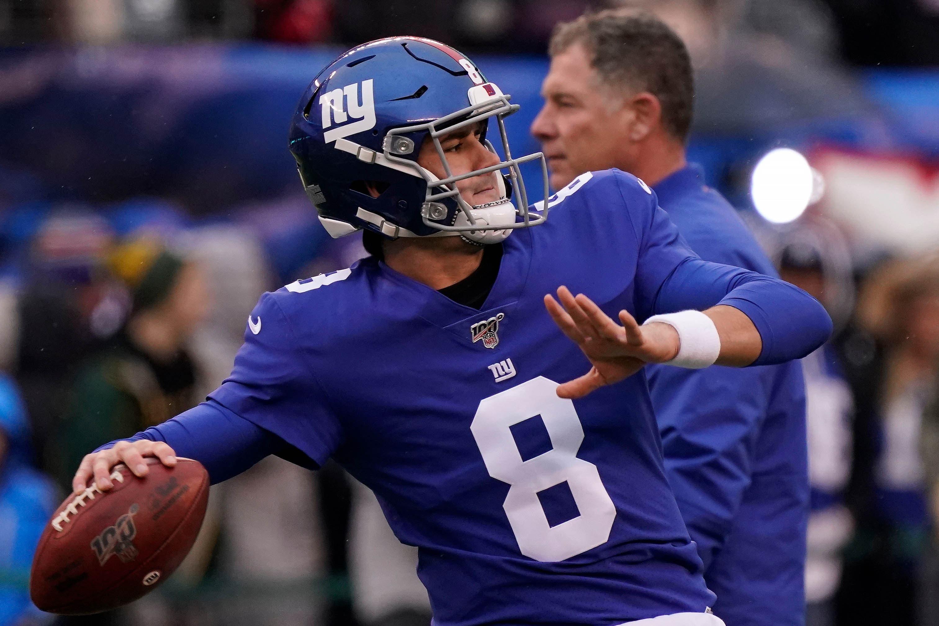 Dec 1, 2019; East Rutherford, NJ, USA; 
New York Giants quarterback Daniel Jones (8) warms up as head coach Pat Shurmur walks past before the game against the Packers at MetLife Stadium. Mandatory Credit: Robert Deutsch-USA TODAY Sports / Robert Deutsch