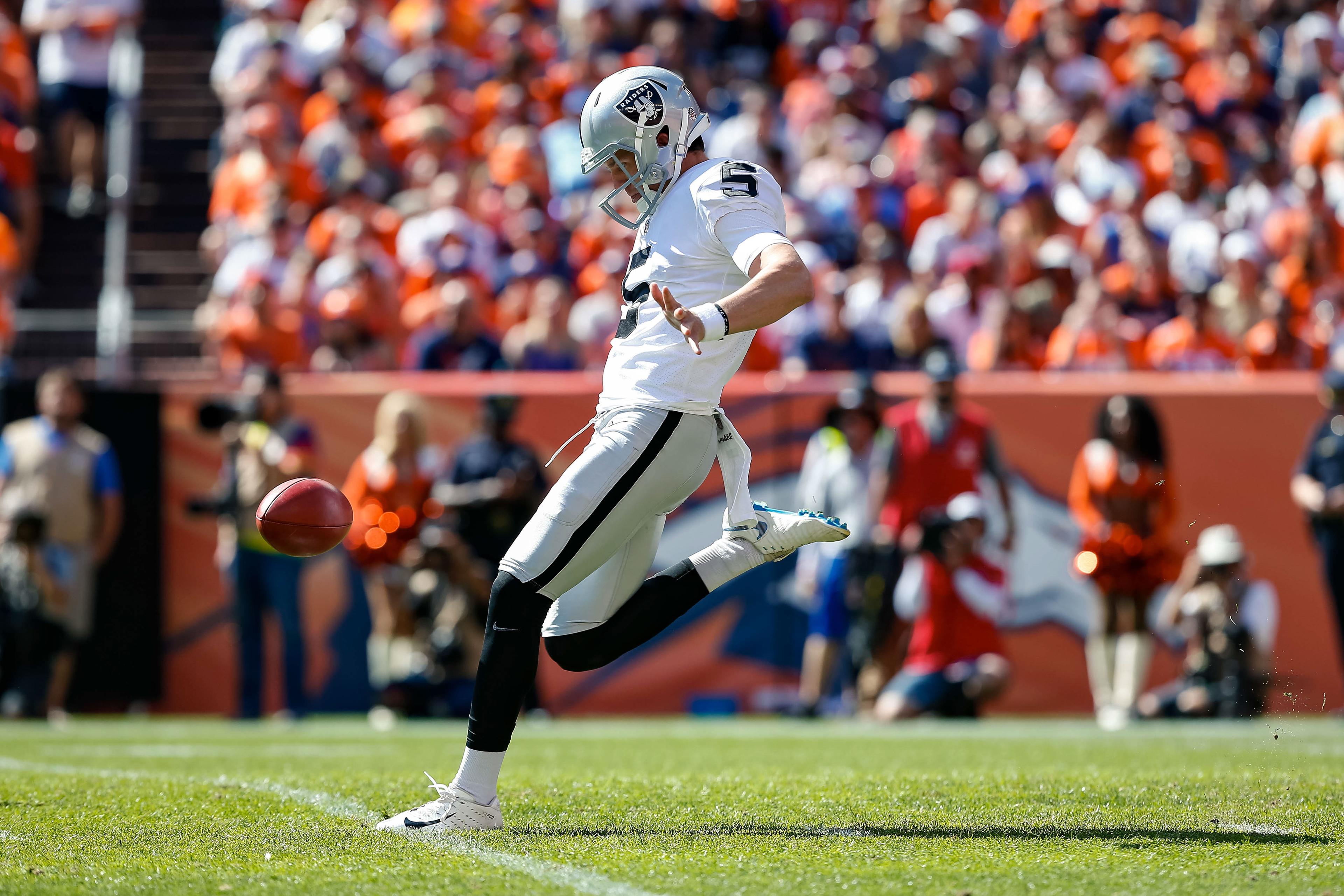 Sep 16, 2018; Denver, CO, USA; Oakland Raiders punter Johnny Townsend (5) punts the ball in the first quarter against the Denver Broncos at Broncos Stadium at Mile High. Mandatory Credit: Isaiah J. Downing-USA TODAY Sports