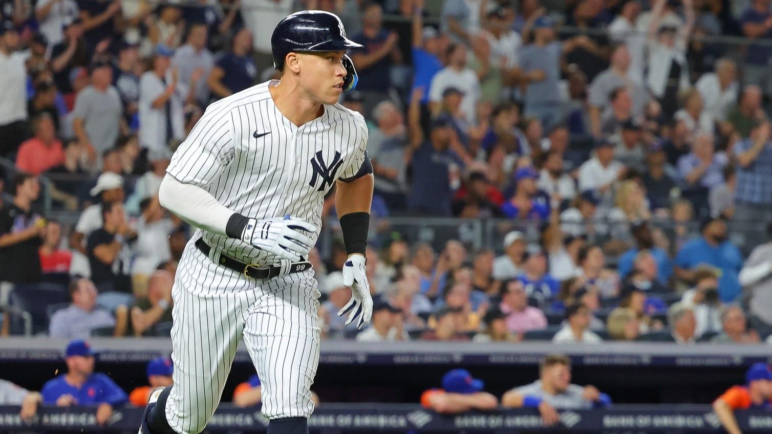 Aug 23, 2022; Bronx, New York, USA; New York Yankees right fielder Aaron Judge (99) watches his RBI single during the seventh inning against the New York Mets at Yankee Stadium.