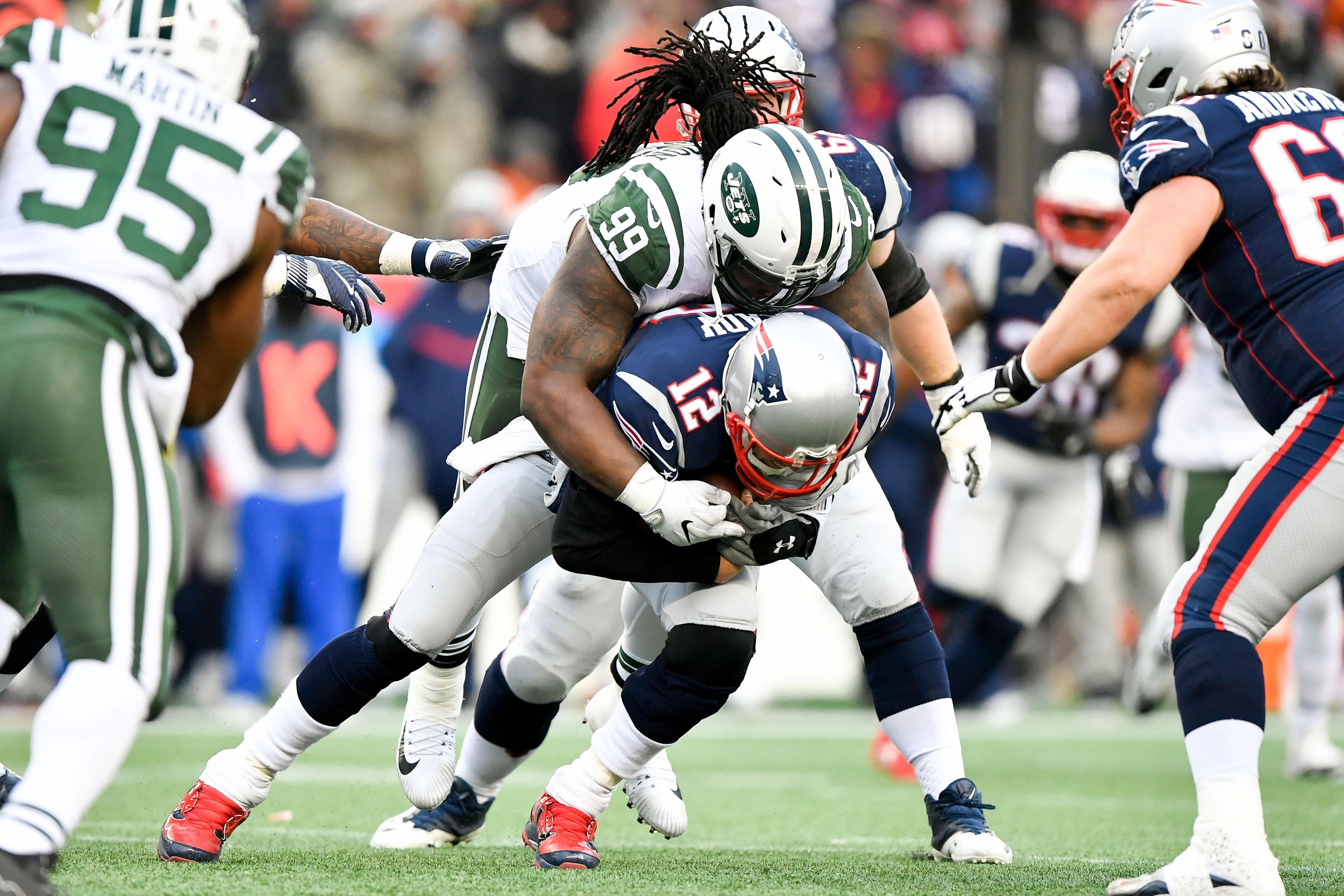 Dec 31, 2017; Foxborough, MA, USA; New England Patriots quarterback Tom Brady (12) is sacked by New York Jets nose tackle Steve McLendon (99) during the second half at Gillette Stadium. Mandatory Credit: Brian Fluharty-USA TODAY Sports / Brian Fluharty