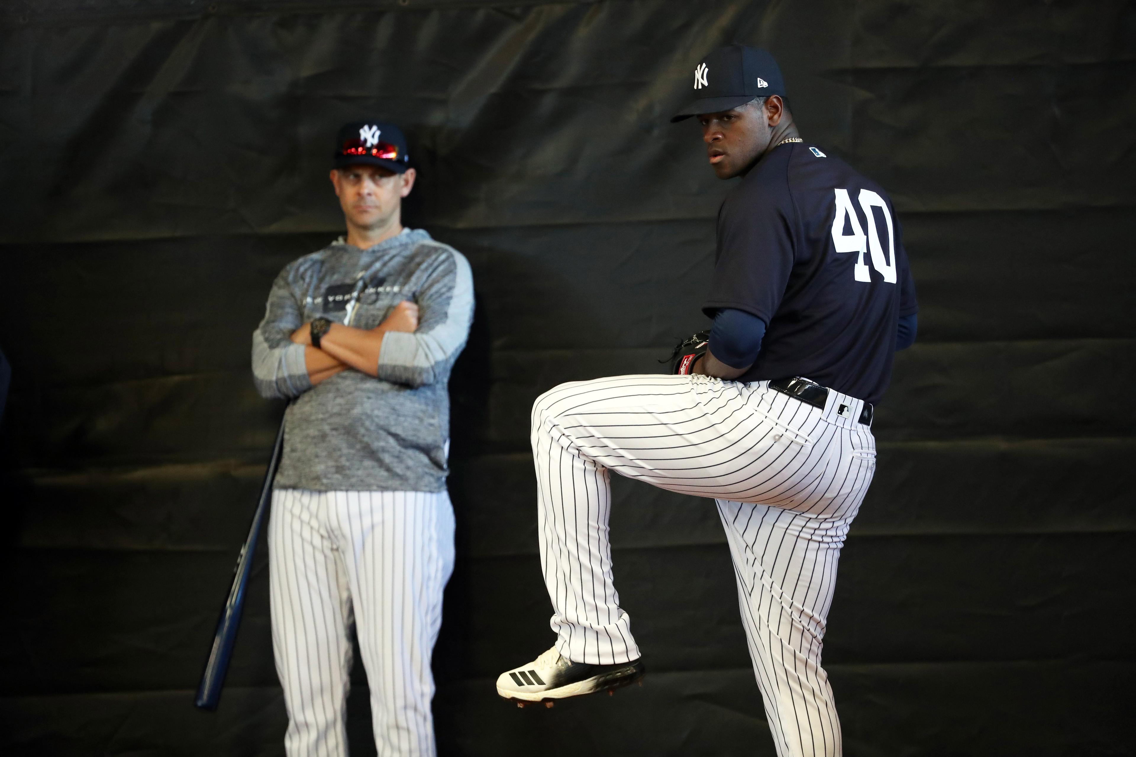 Feb 14, 2019; Tampa, FL, USA;New York Yankees starting pitcher Luis Severino (40) throws a bullpen session as manager Aaron Boone (17) looks on during spring training at George M. Steinbrenner Field. Mandatory Credit: Kim Klement-USA TODAY Sports