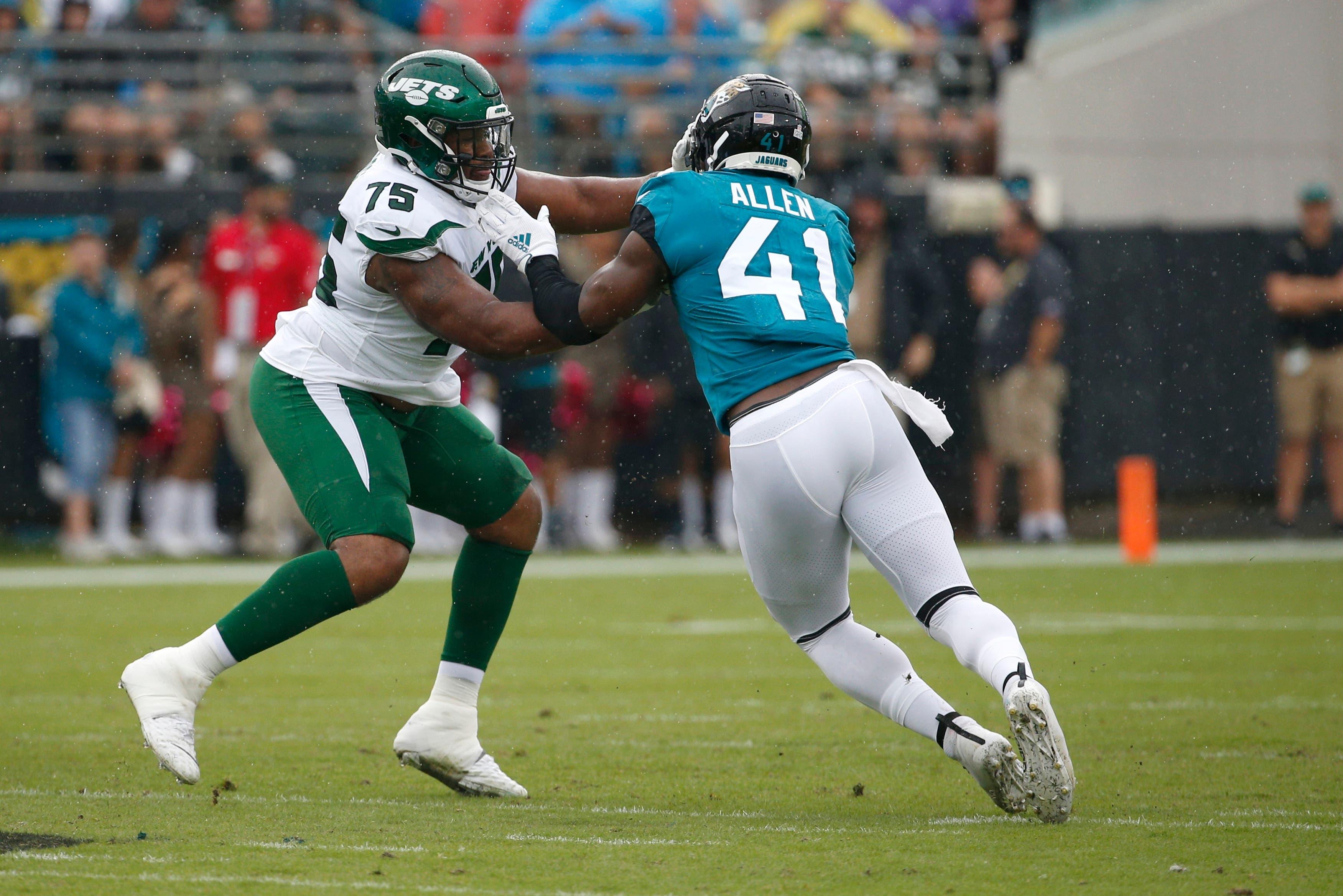 New York Jets offensive tackle Chuma Edoga (75) blocks Jacksonville Jaguars defensive end Josh Allen (41) during the first half of an NFL football game, Sunday, Oct. 27, 2019, in Jacksonville, Fla. (AP Photo/Stephen B. Morton) / Stephen B. Morton/AP