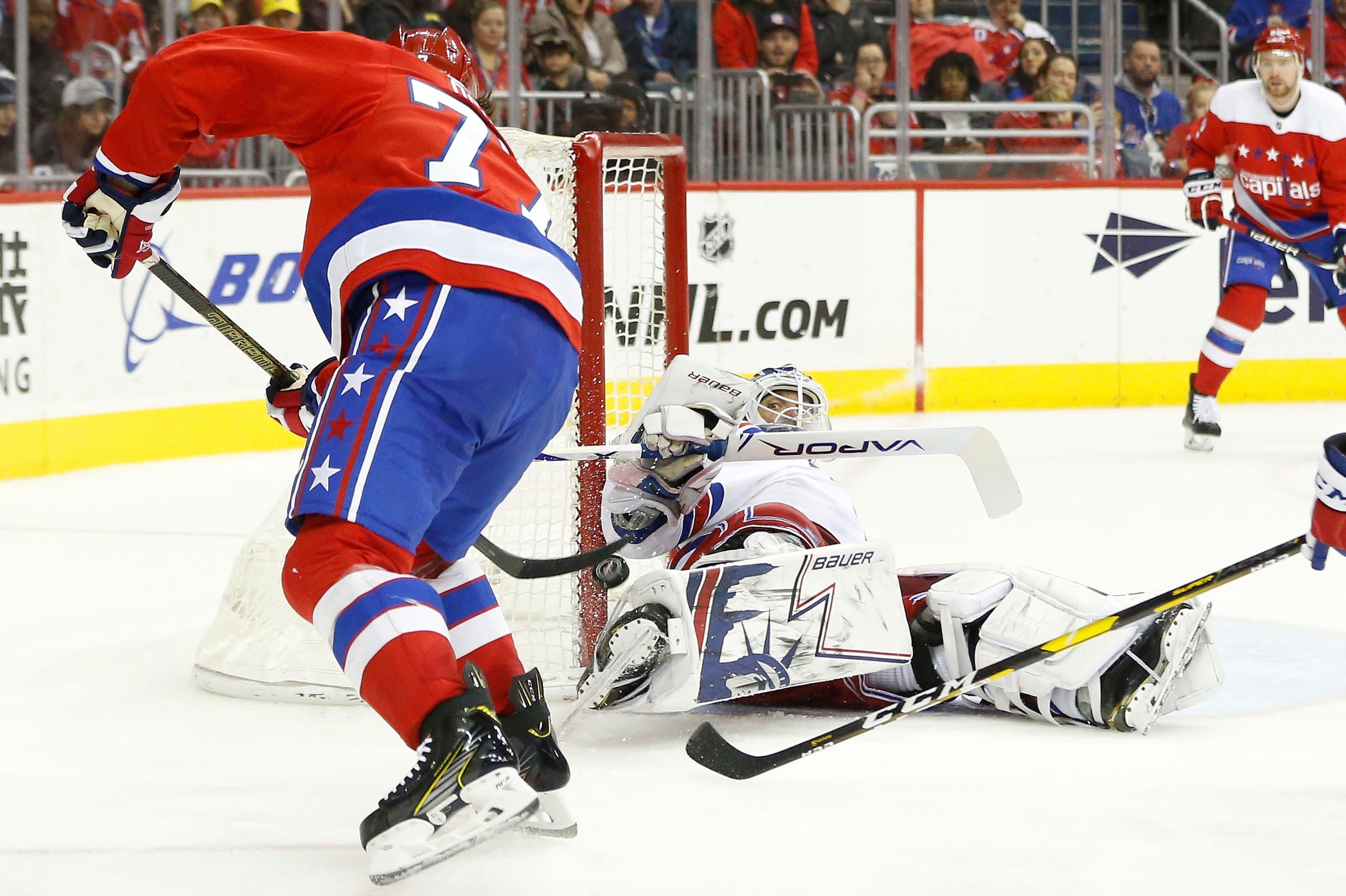 New York Rangers goaltender Henrik Lundqvist makes a save on Washington Capitals right wing T.J. Oshie in the second period at Capital One Arena. / Geoff Burke/USA TODAY Sports