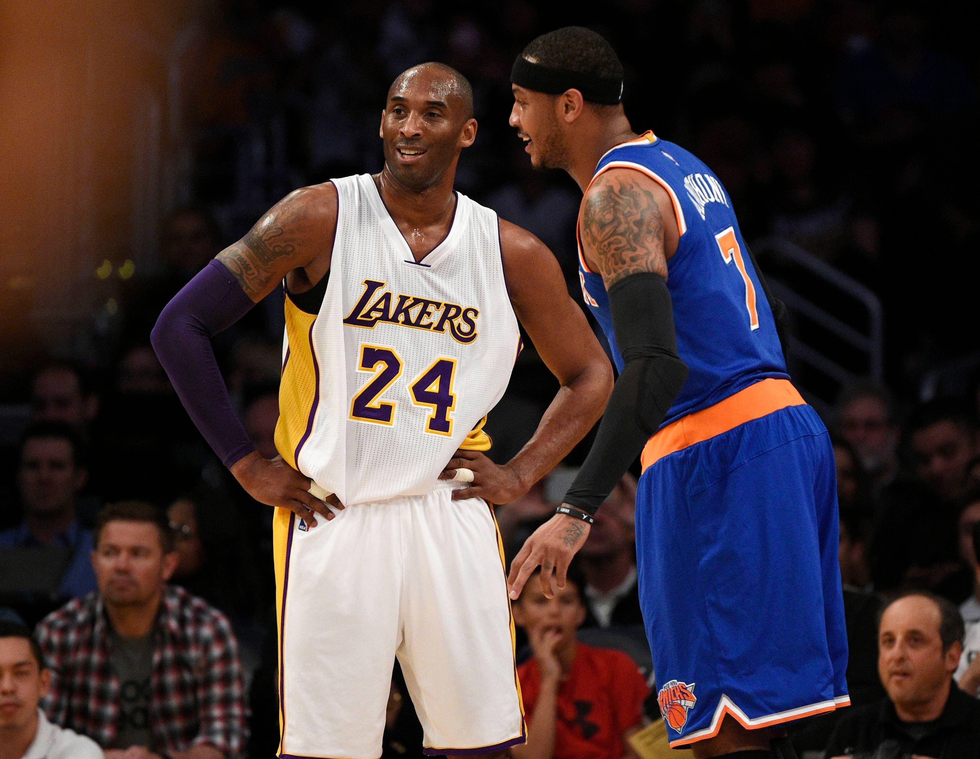 Mar 13, 2016; Los Angeles, CA, USA; Los Angeles Lakers forward Kobe Bryant (24) talks with New York Knicks forward Carmelo Anthony (right) during the first quarter at Staples Center. Mandatory Credit: Kelvin Kuo-USA TODAY Sports / Kelvin Kuo